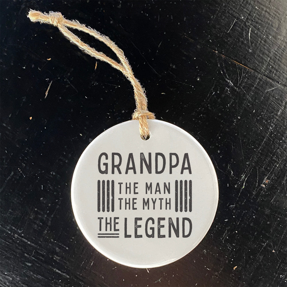 A beautifully crafted porcelain ornament featuring the text 'Grandpa / Father The Legend', showcasing vibrant colors and a glossy finish.