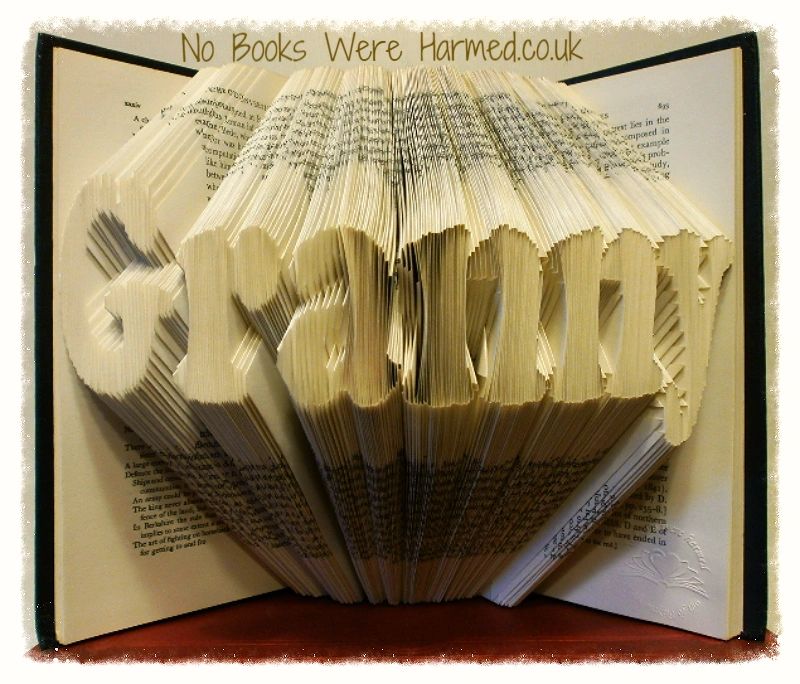 Handcrafted Granny book art made from vintage books, showcasing unique folded pages in various colors and textures.