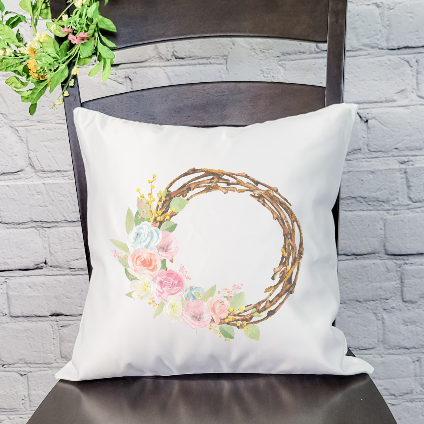 Grapevine Floral Wreath Pillow Cover featuring a floral design on a soft linen fabric with a hidden zipper.