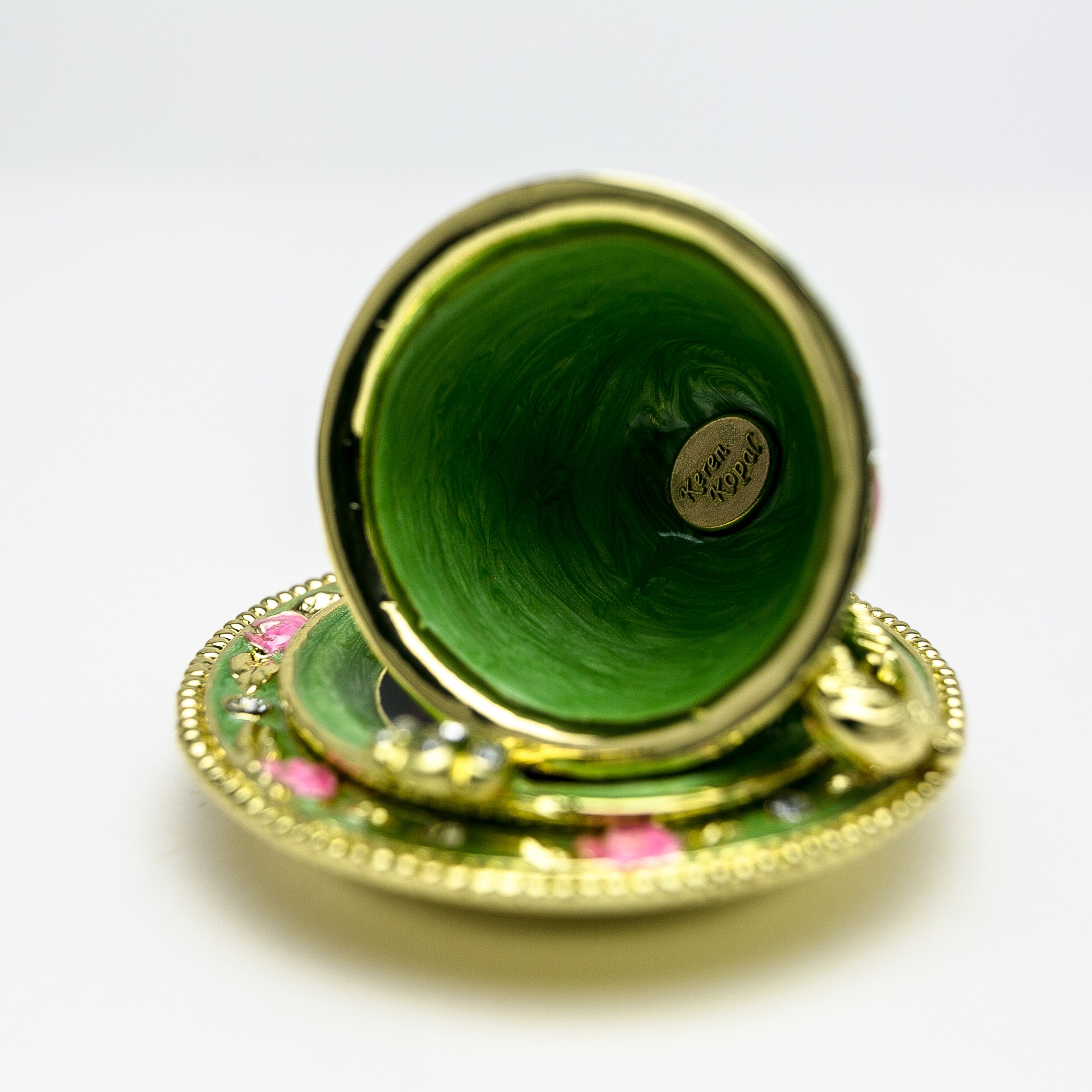 A beautifully handcrafted Green Cup of Tea trinket box adorned with Austrian crystals and plated with 24K gold, showcasing intricate enamel work.