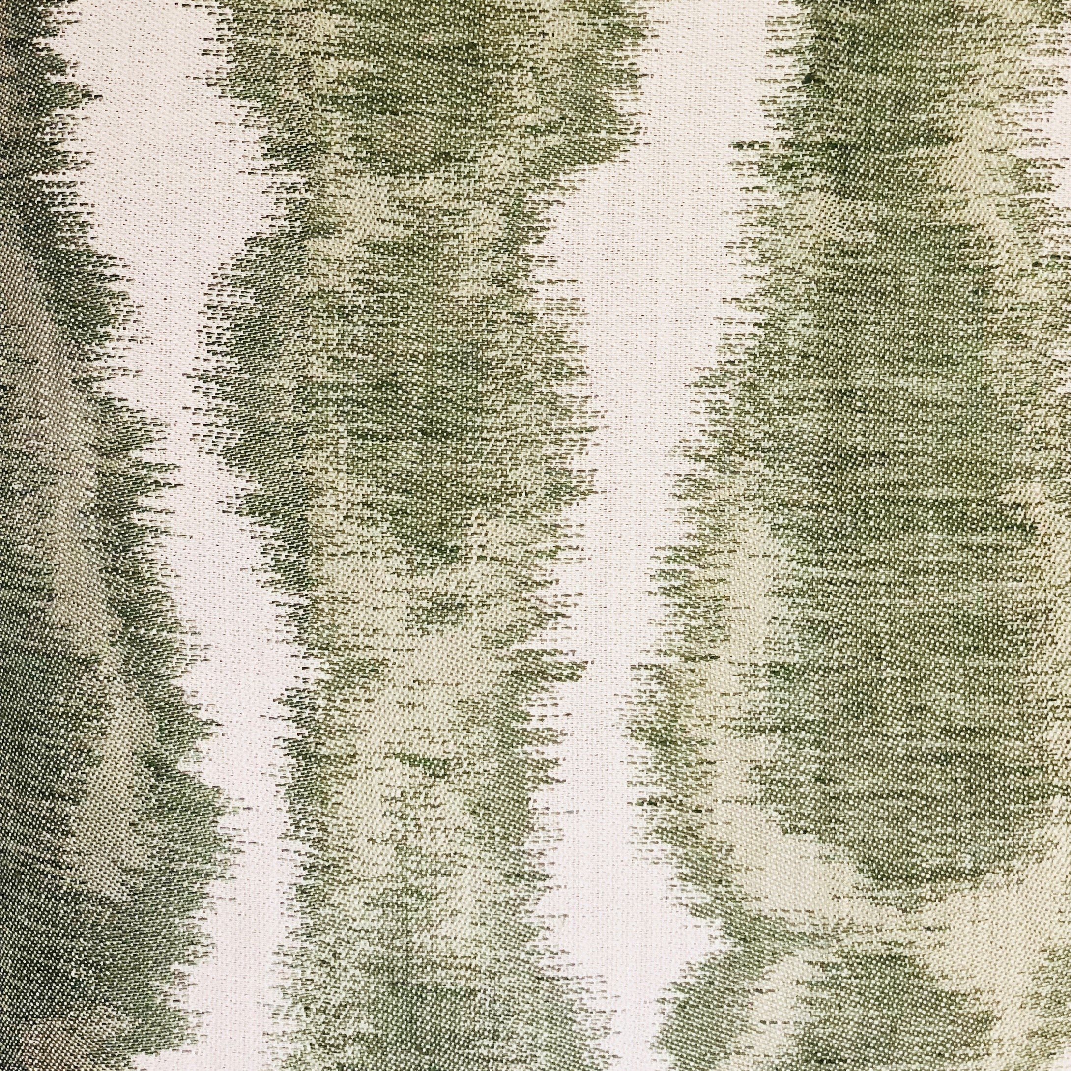 Green Haven Green and Beige Luxury Throw Pillow featuring an ikat pattern, handmade in the USA with a soft cotton-linen blend.