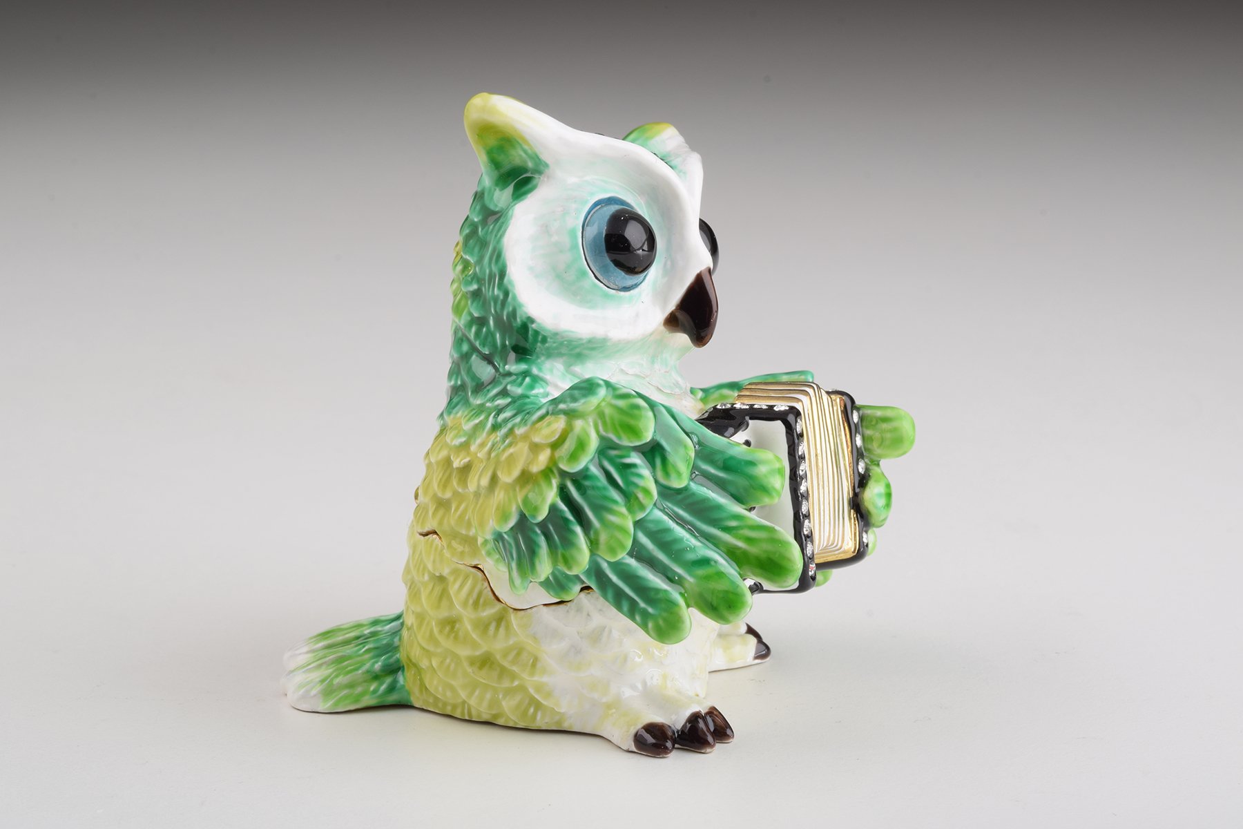 Handmade Green Owl Playing Accordion Trinket Box with Austrian crystals and 24K gold plating, featuring a secure magnetic fastener.