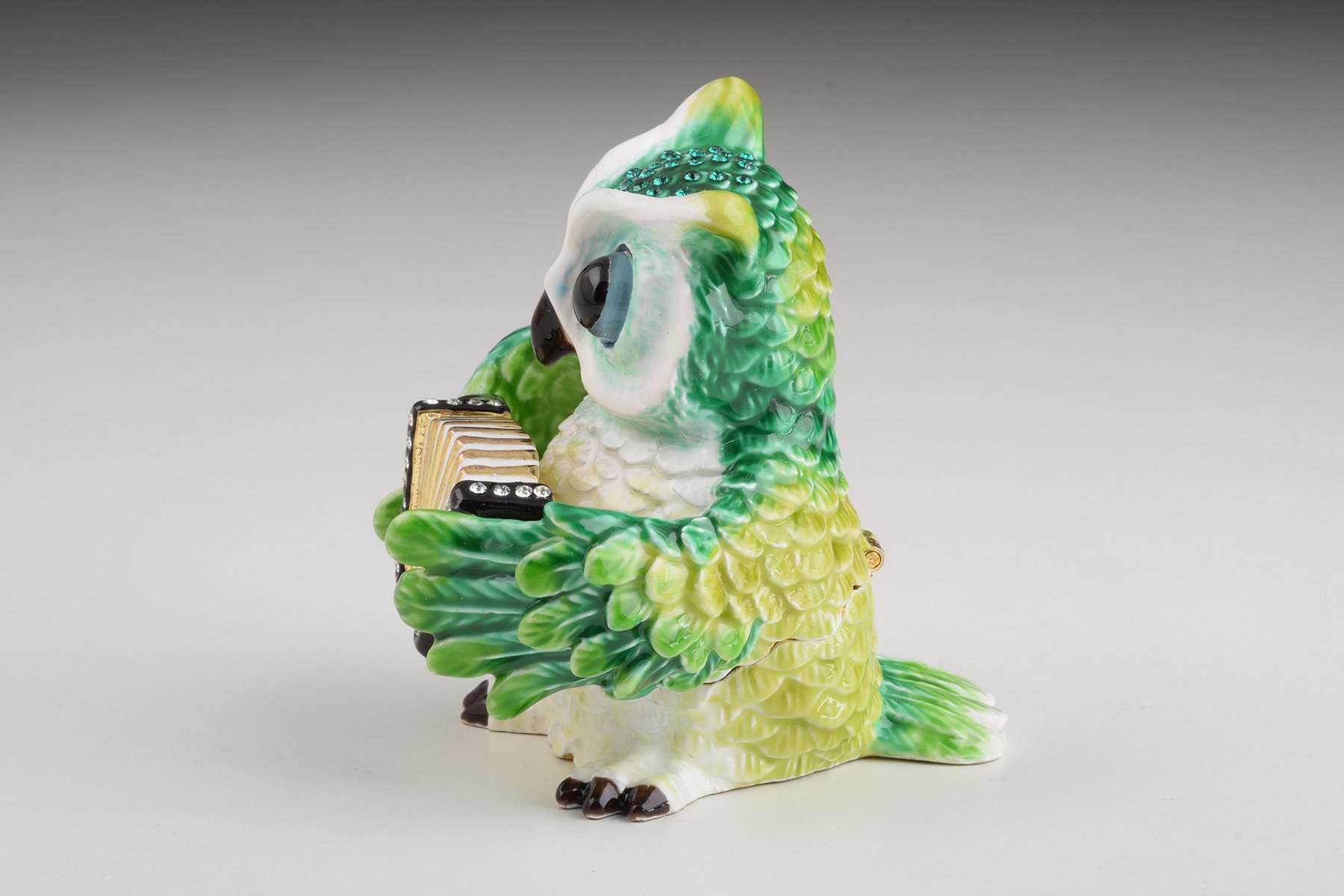 Handmade Green Owl Playing Accordion Trinket Box with Austrian crystals and 24K gold plating, featuring a secure magnetic fastener.