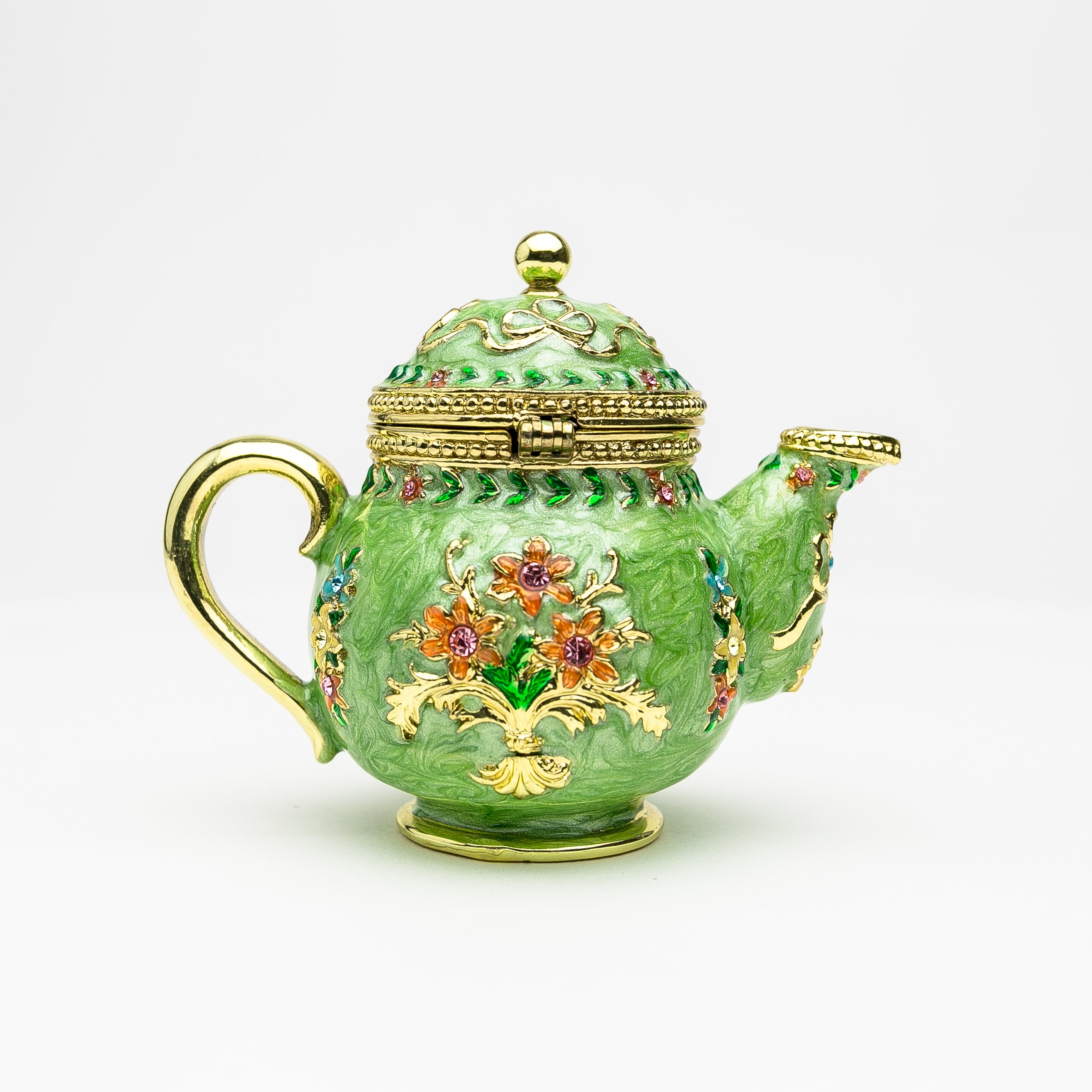 A beautifully crafted Green Teapot trinket box, handmade with Austrian crystals and plated with 24K gold or 925 silver, showcasing intricate details.