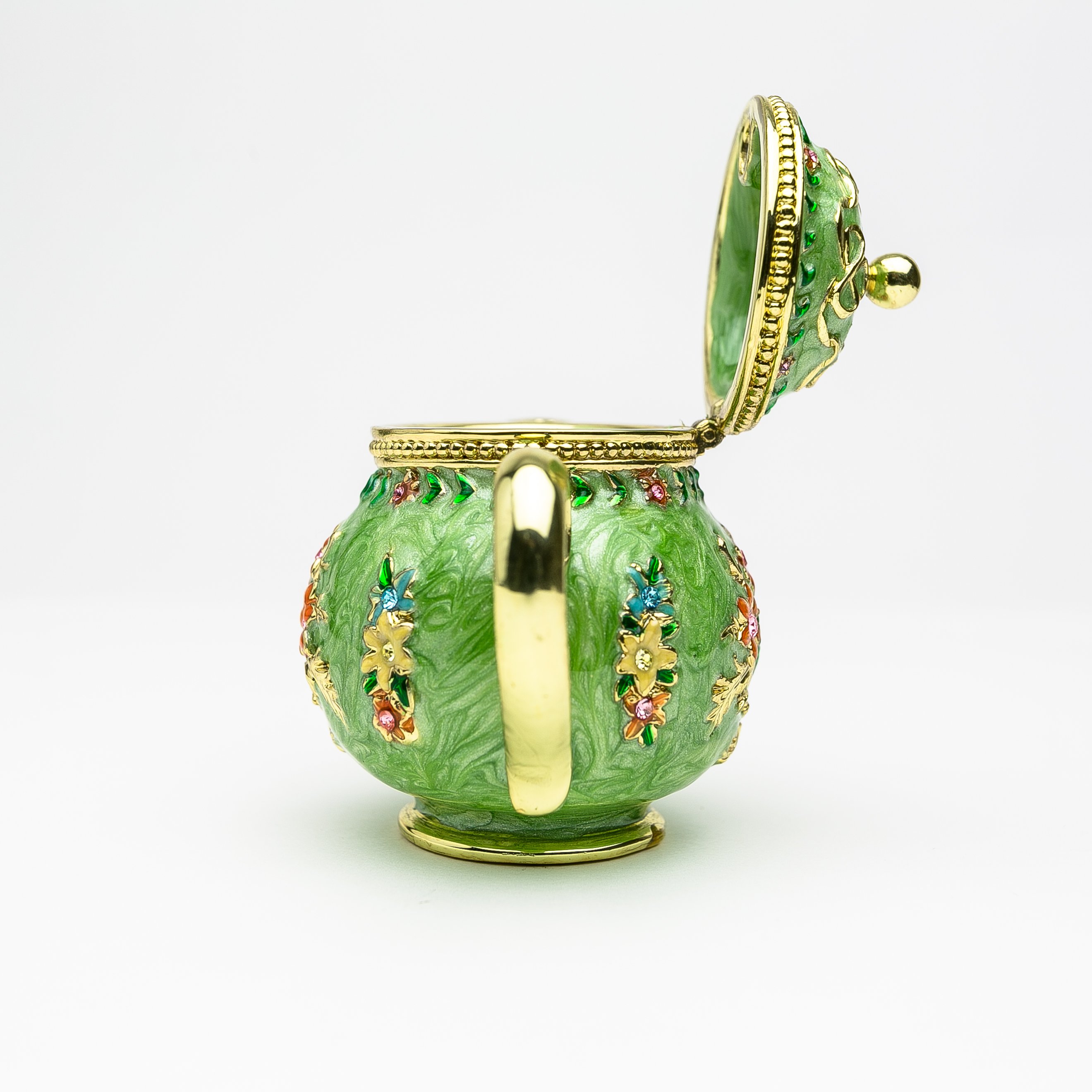 A beautifully crafted Green Teapot trinket box, handmade with Austrian crystals and plated with 24K gold or 925 silver, showcasing intricate details.