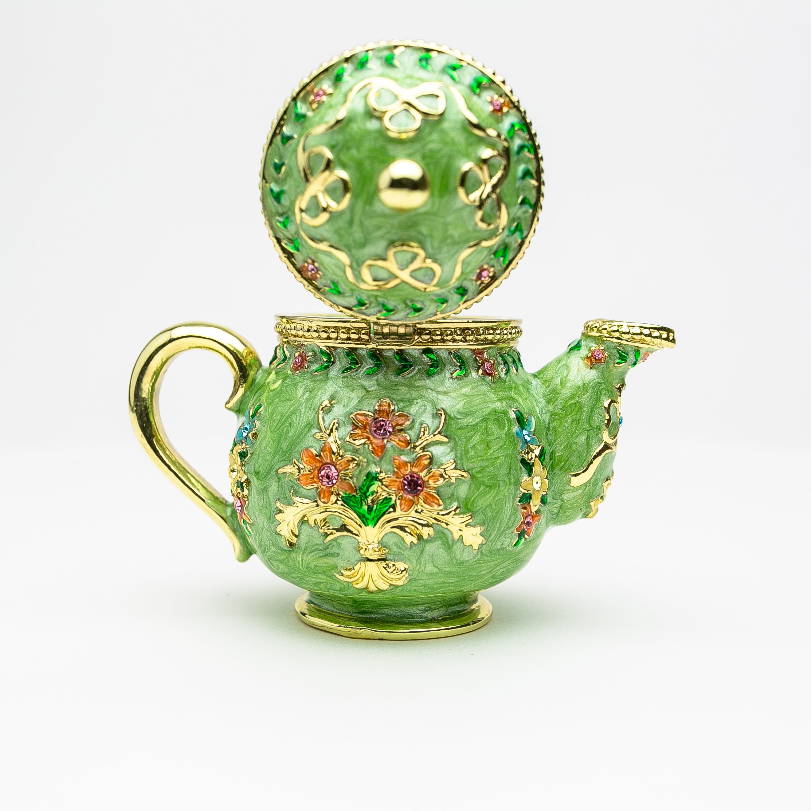 A beautifully crafted Green Teapot trinket box, handmade with Austrian crystals and plated with 24K gold or 925 silver, showcasing intricate details.