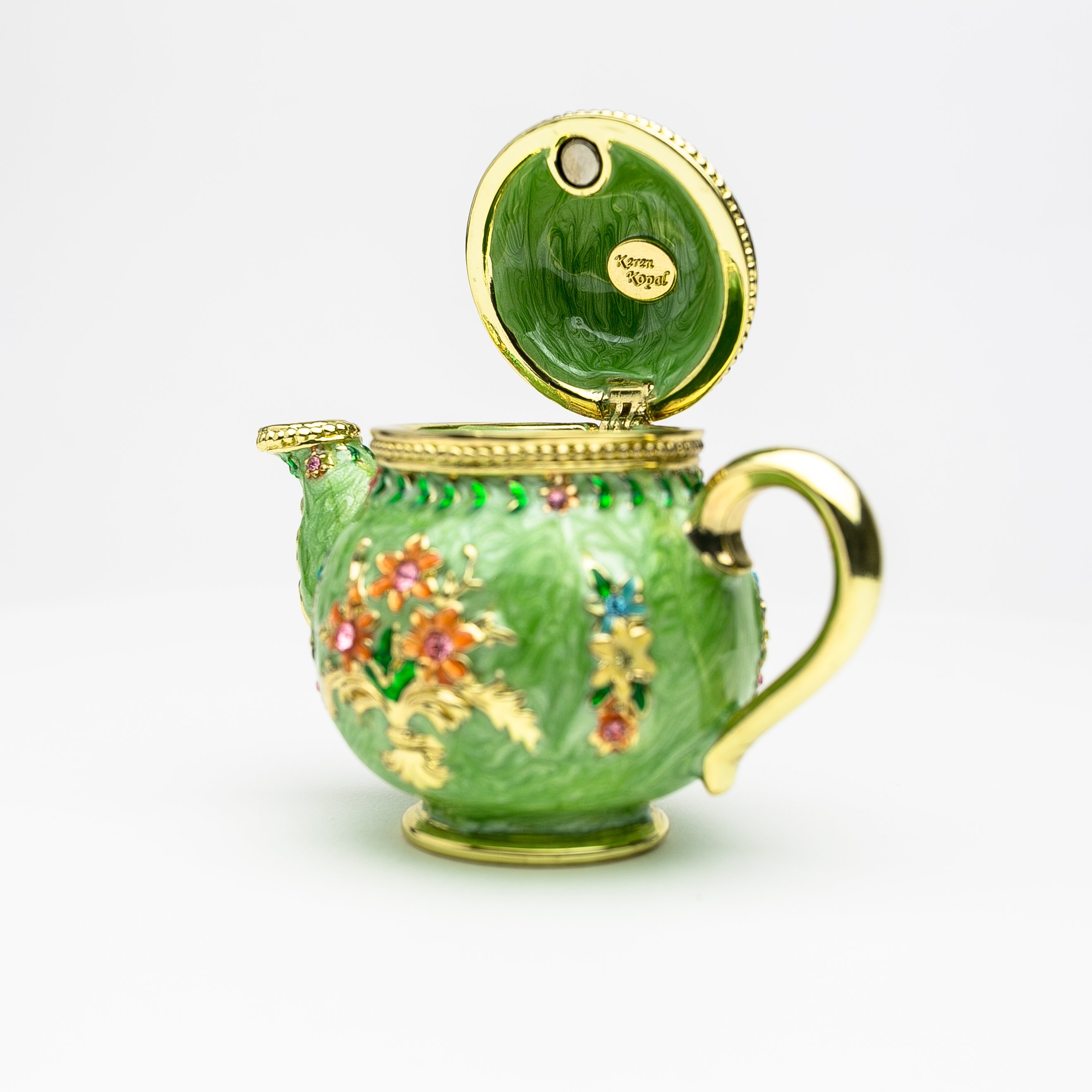 A beautifully crafted Green Teapot trinket box, handmade with Austrian crystals and plated with 24K gold or 925 silver, showcasing intricate details.