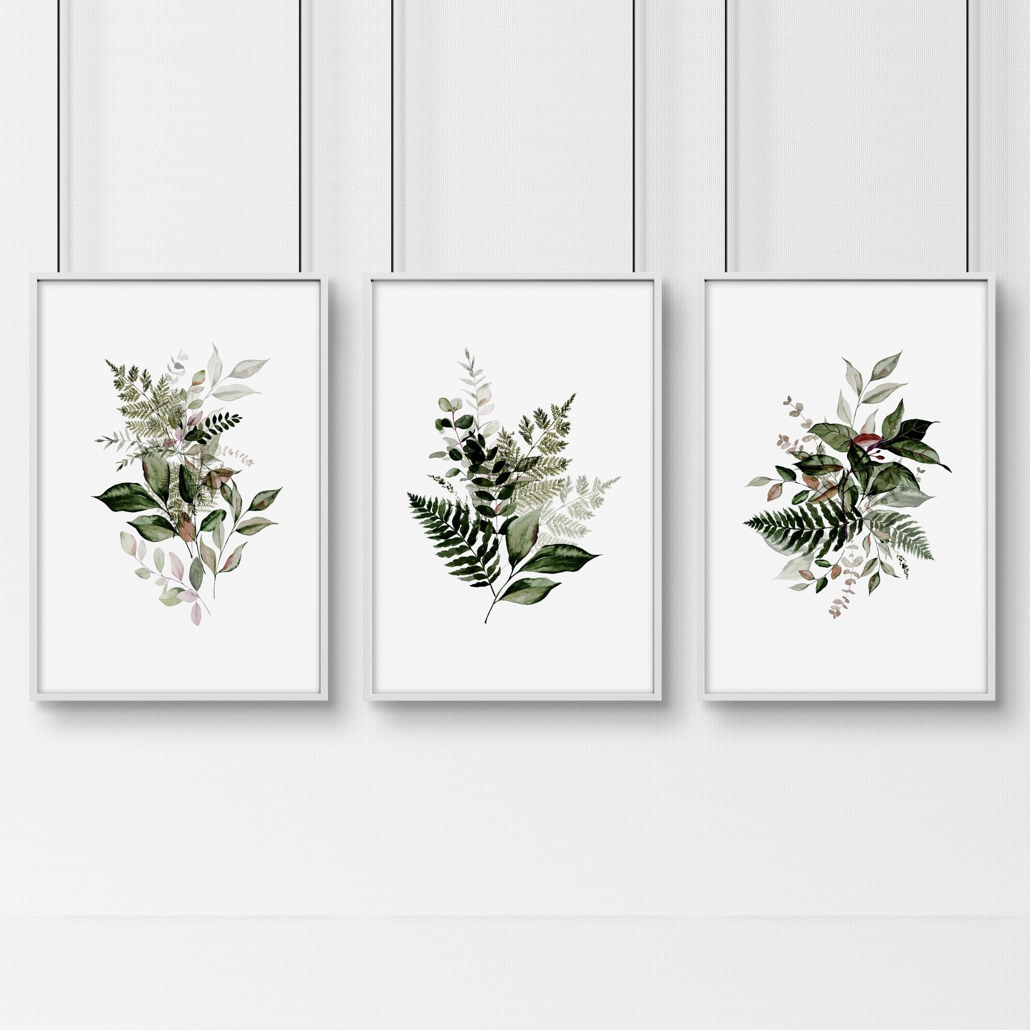 Set of 3 Greenery wall art prints featuring vibrant foliage designs, perfect for home or office decor.