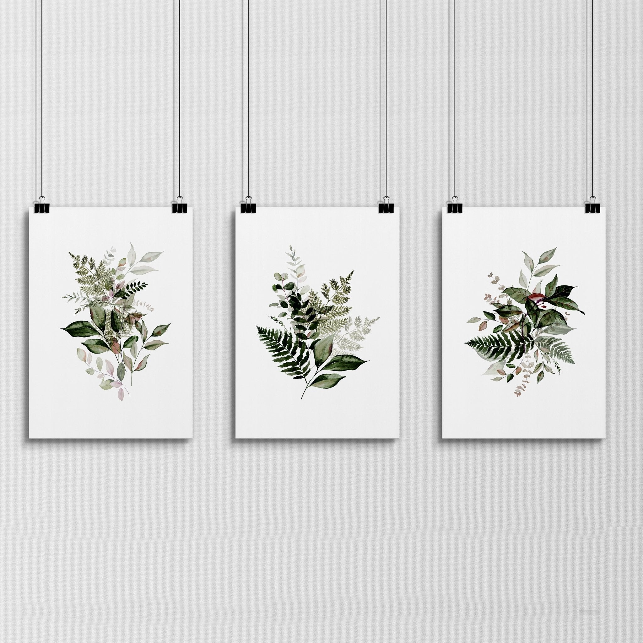 Set of 3 Greenery wall art prints featuring vibrant foliage designs, perfect for home or office decor.