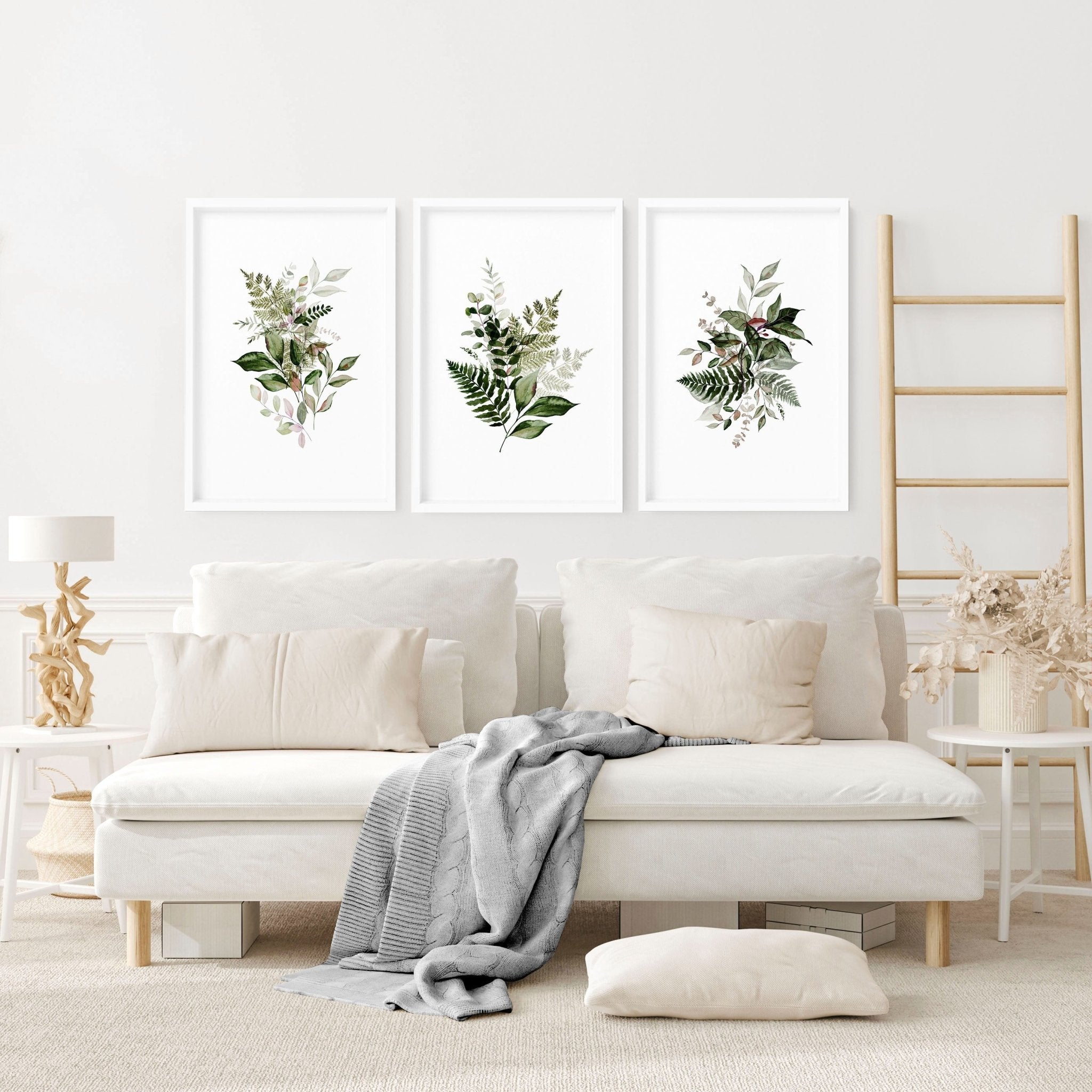 Set of 3 Greenery wall art prints featuring vibrant foliage designs, perfect for home or office decor.