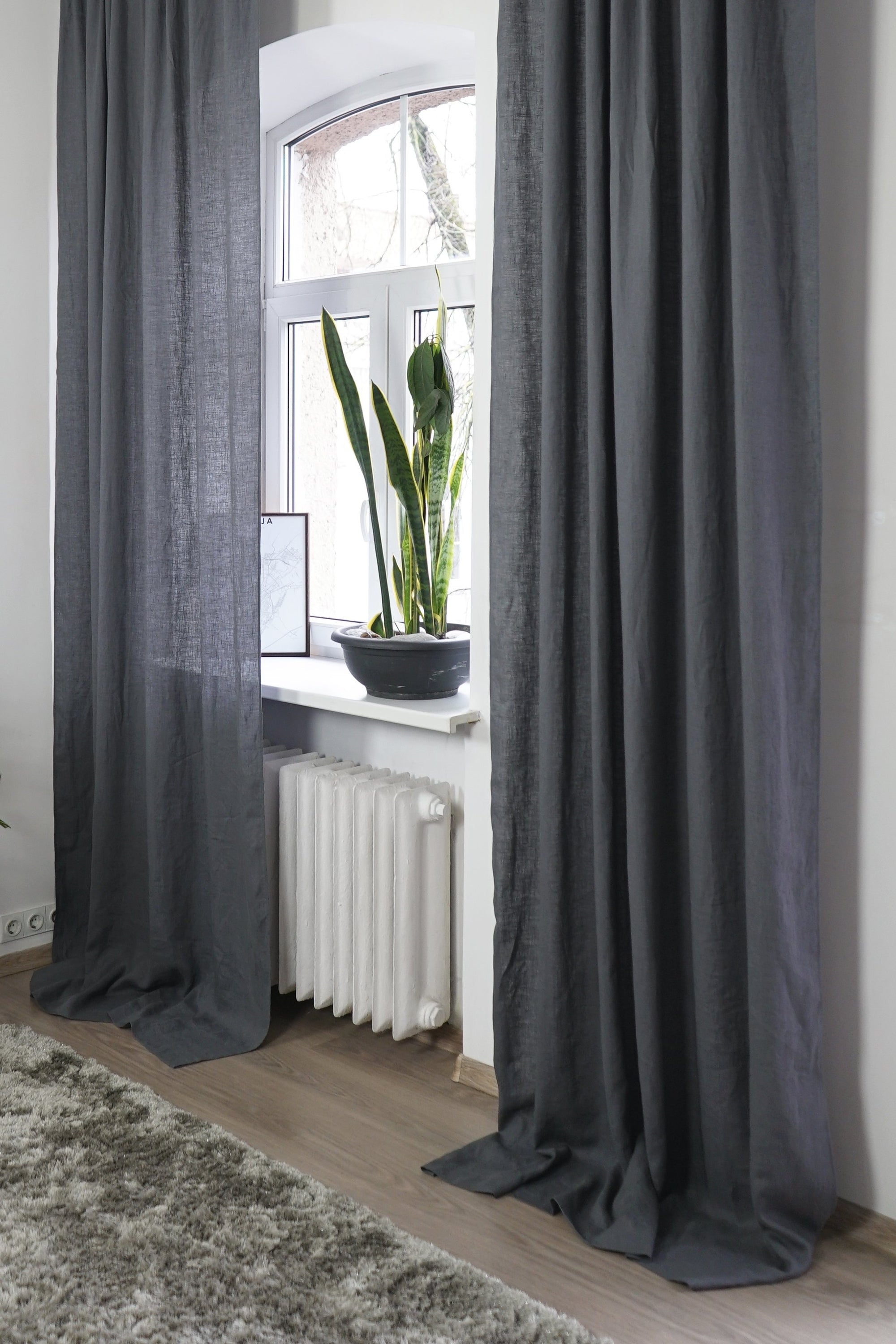 Soft greyish mint linen curtain with multifunctional tape, elegantly draped to showcase its semi-sheer texture and versatile hanging options.