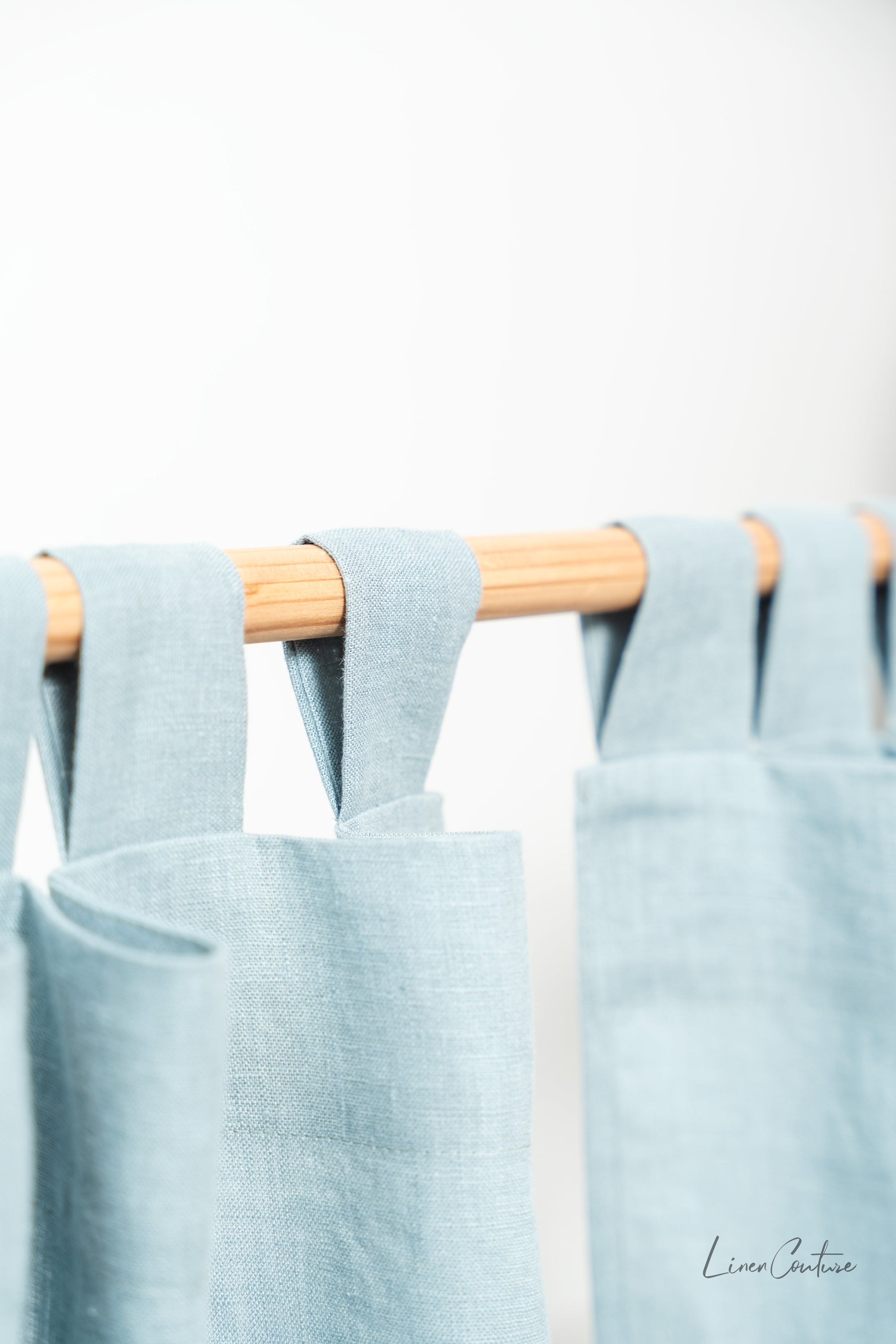 Greyish Mint linen curtain with tab tops, showcasing a soft texture and elegant color, perfect for enhancing any room's decor.