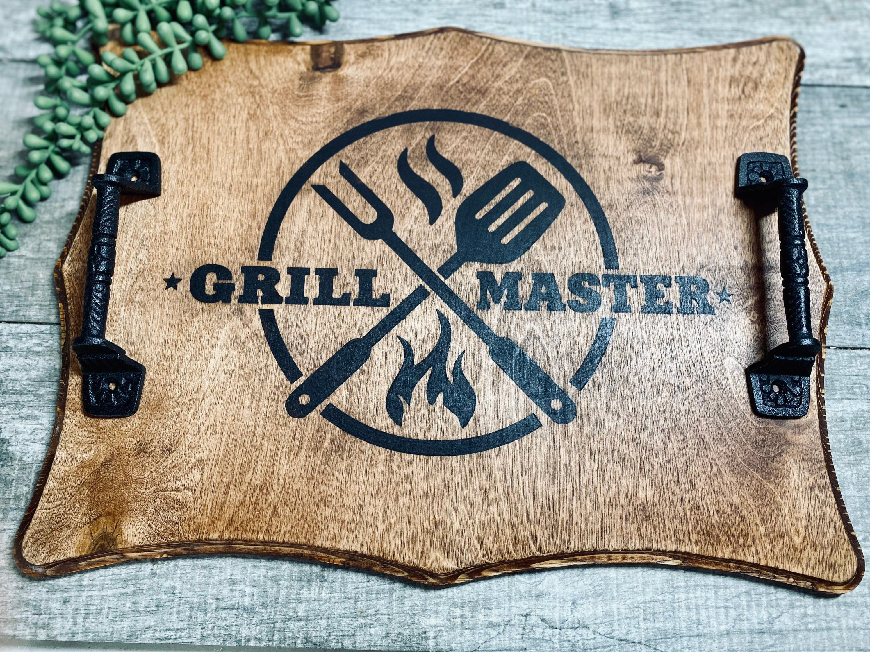 Handmade wooden Grill Master Serving Tray with cast iron handles, stained in rich chestnut color, featuring a unique burned design.