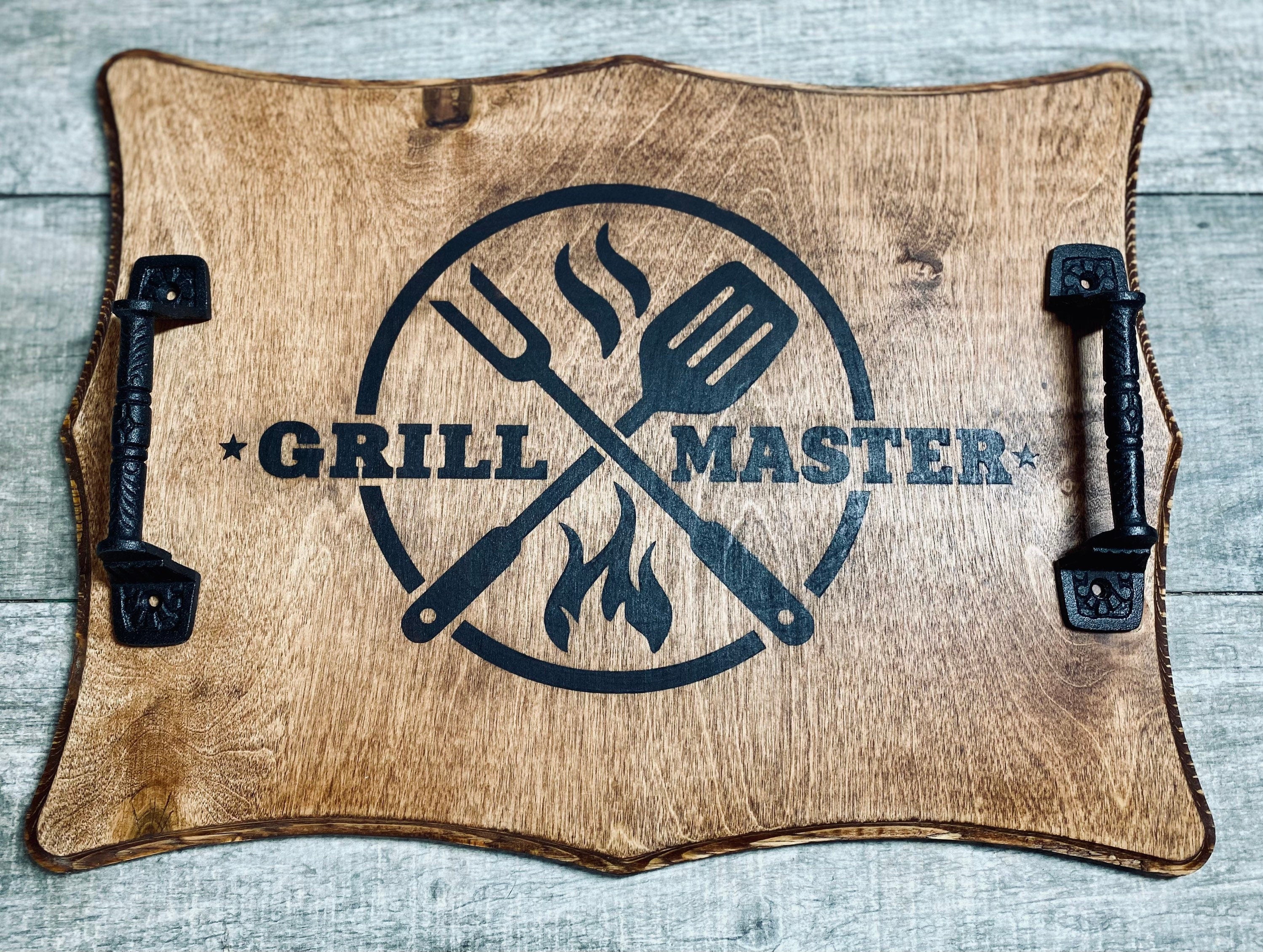 Handmade wooden Grill Master Serving Tray with cast iron handles, stained in rich chestnut color, featuring a unique burned design.