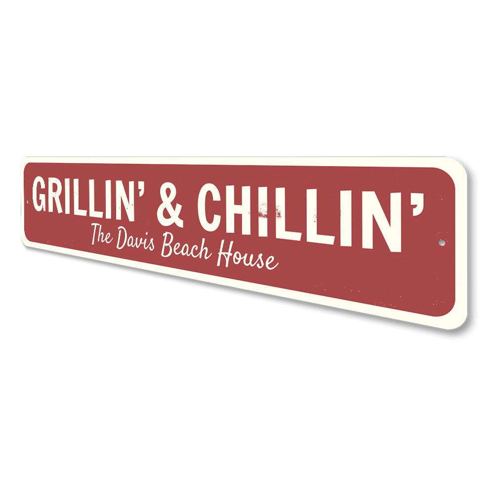 Red beach house grill sign.