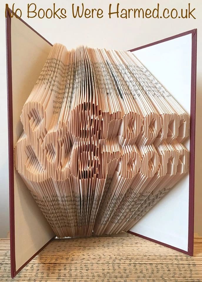 Handcrafted Groom & Groom book art made from vintage books, showcasing intricate page folds and unique designs.