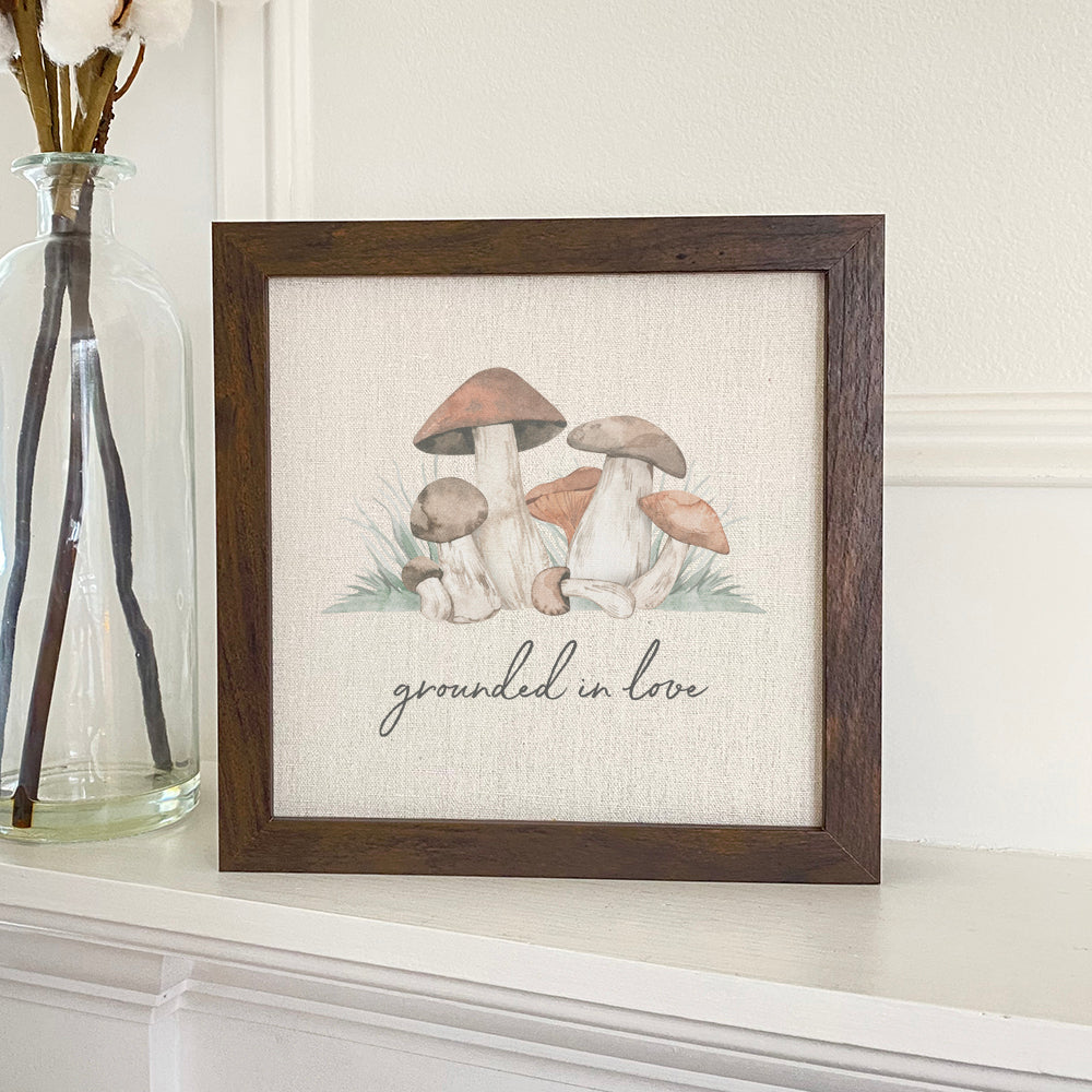 Grounded in Love framed sign featuring mushrooms, eco-friendly ink on a linen-look background with a rustic wood frame.