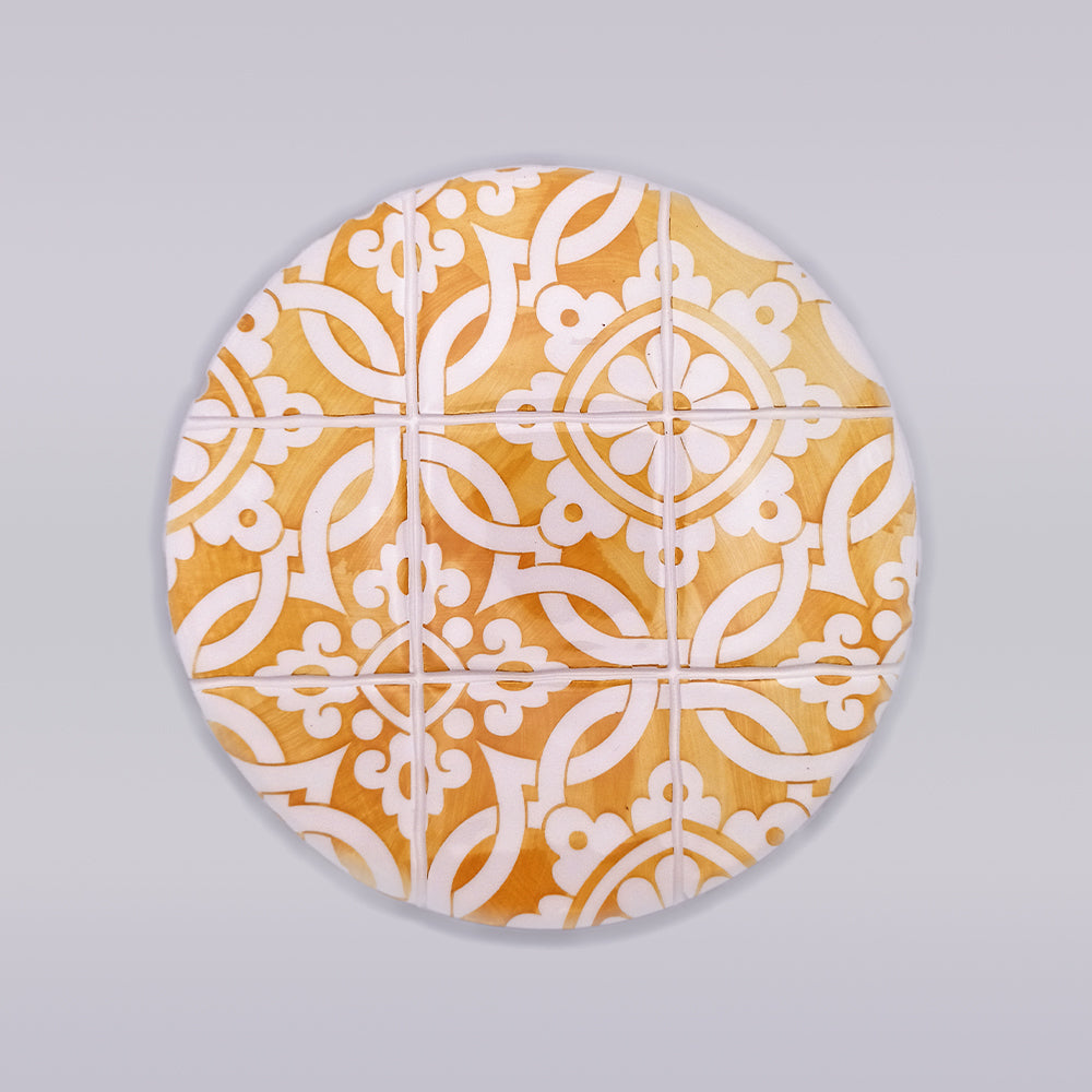 Guimaraes Ceramic Trivet featuring intricate hand-painted designs, perfect for protecting countertops from hot pans.