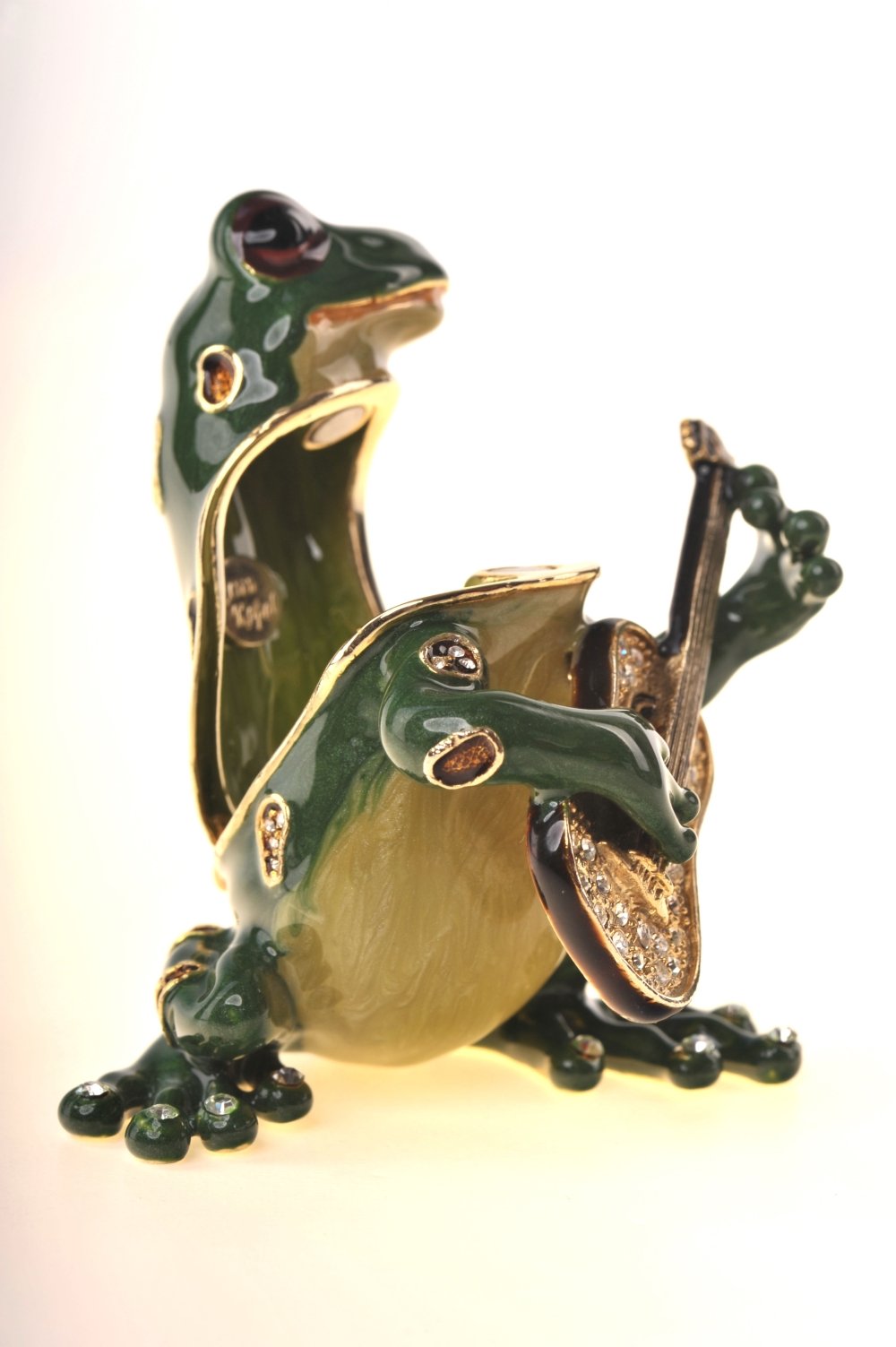 A beautifully crafted enamel painted trinket box shaped like a frog playing a guitar, adorned with Austrian crystals and 925 silver plating.