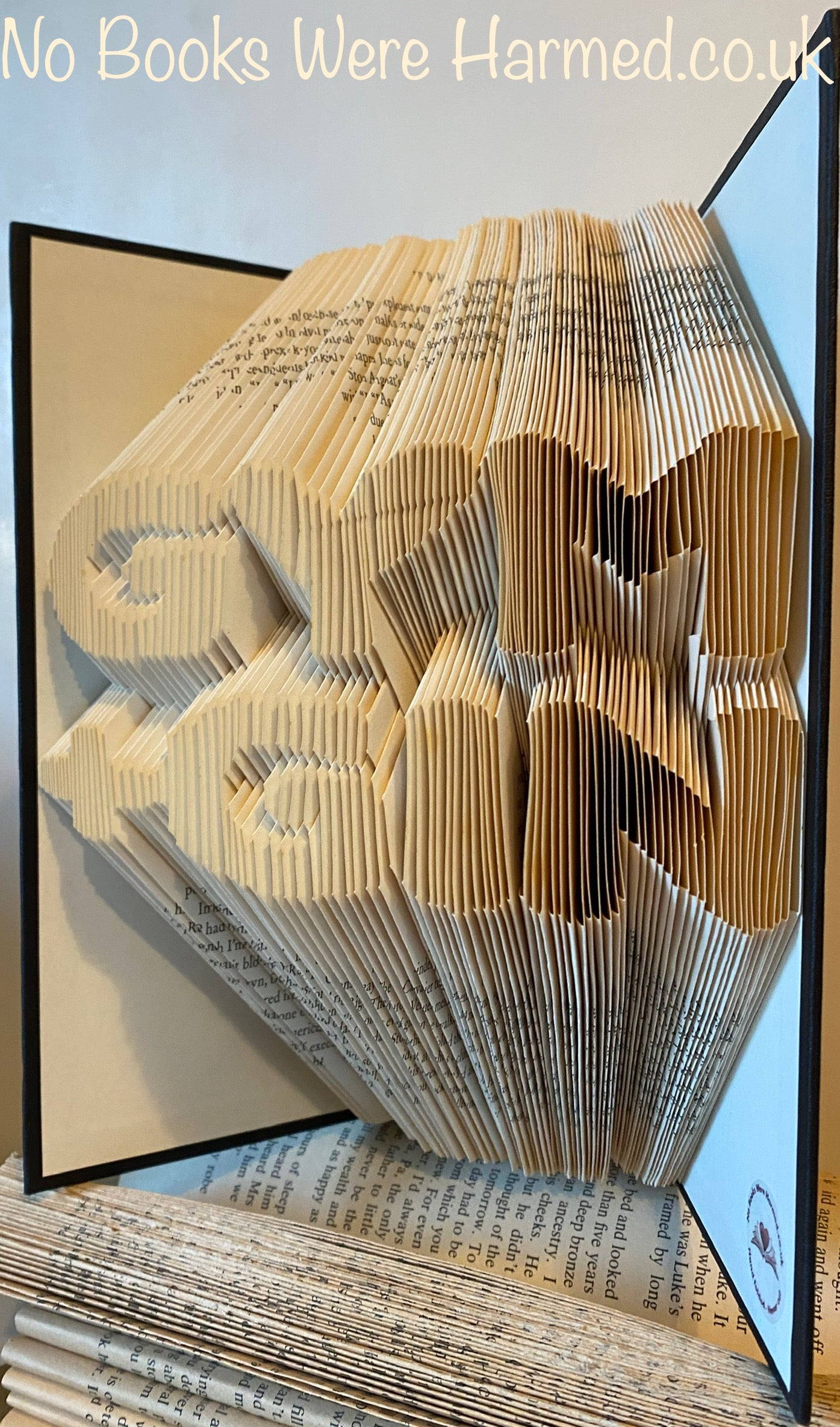 Handcrafted Gym + Gin book art made from vintage books, showcasing unique folded pages in a stylish design.