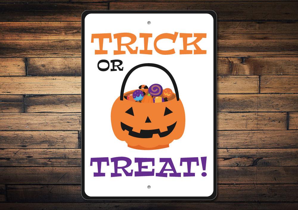 A decorative Halloween Candy Bowl Sign made of aluminum, featuring spooky designs perfect for Halloween decor.