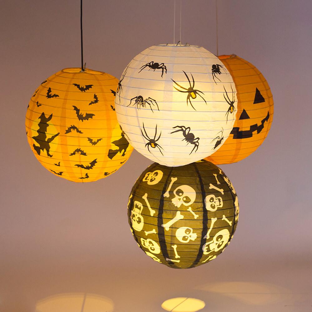 Battery operated round paper lantern ball light in warm white and multicolor, perfect for Halloween decor.