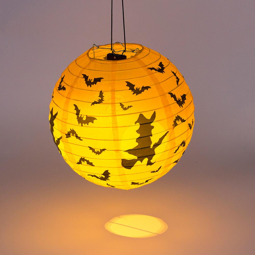 Battery operated round paper lantern ball light in warm white and multicolor, perfect for Halloween decor.