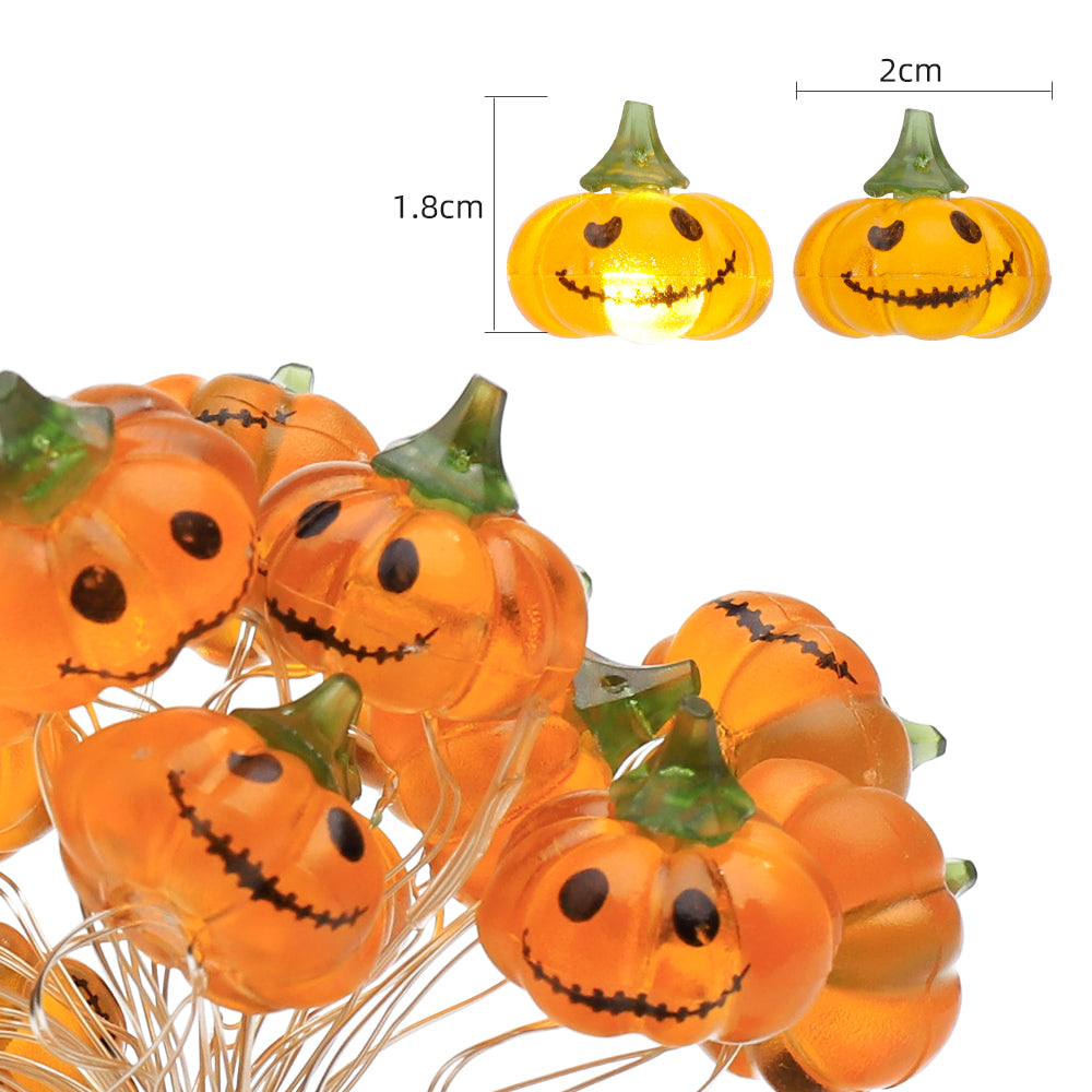 A string of Halloween Smiley Pumpkin lights glowing brightly, showcasing 30 LED pumpkins on a 9.8ft long cable, perfect for festive decorations.