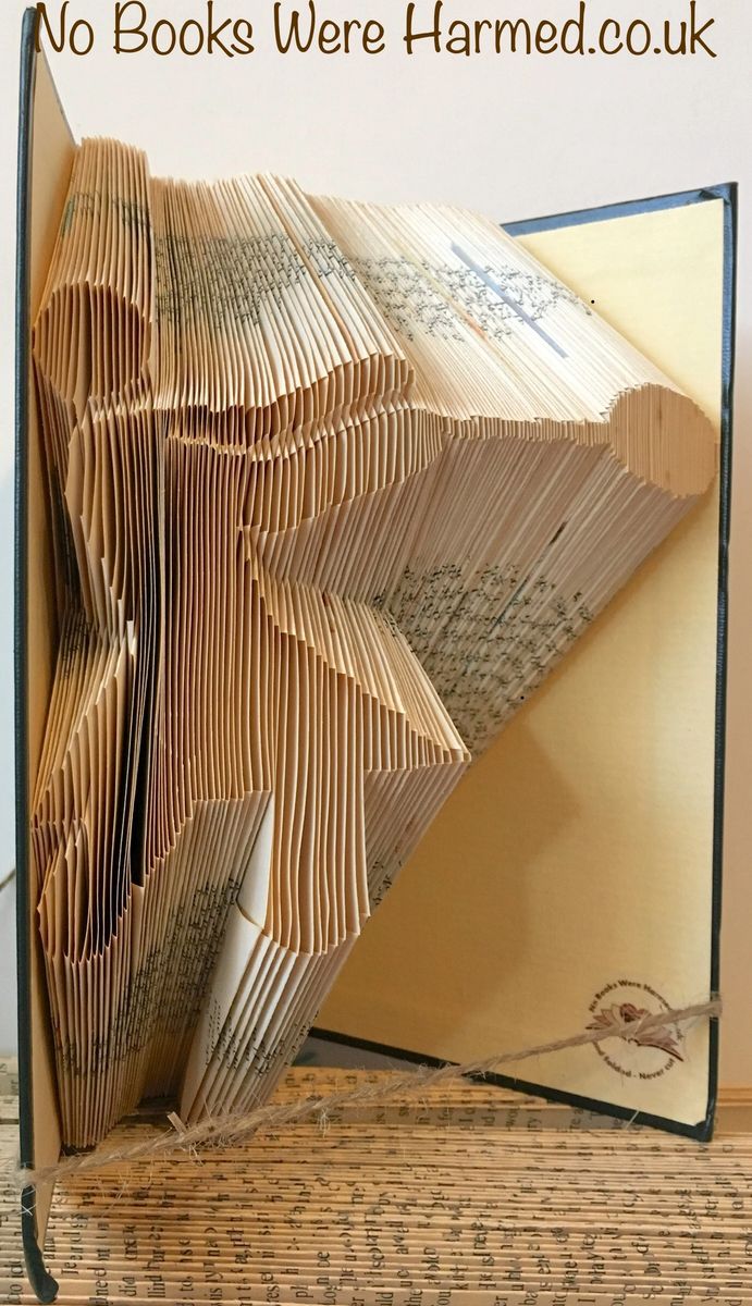 Handcrafted Hammer Thrower art made from vintage book pages, showcasing intricate folds and unique design.