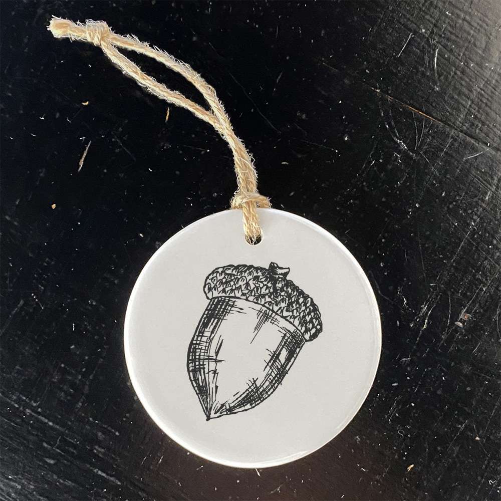 Hand Drawn Acorn Ornament made of high-quality porcelain with a smooth glossy finish, featuring a unique nature-inspired design.