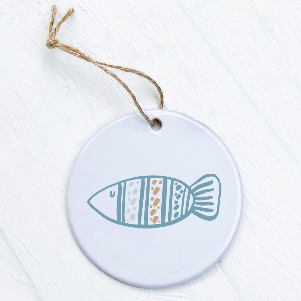 Hand Drawn Fish ornament made of high-quality porcelain, featuring a vibrant design with a smooth gloss finish, measuring 2.75 inches in diameter.