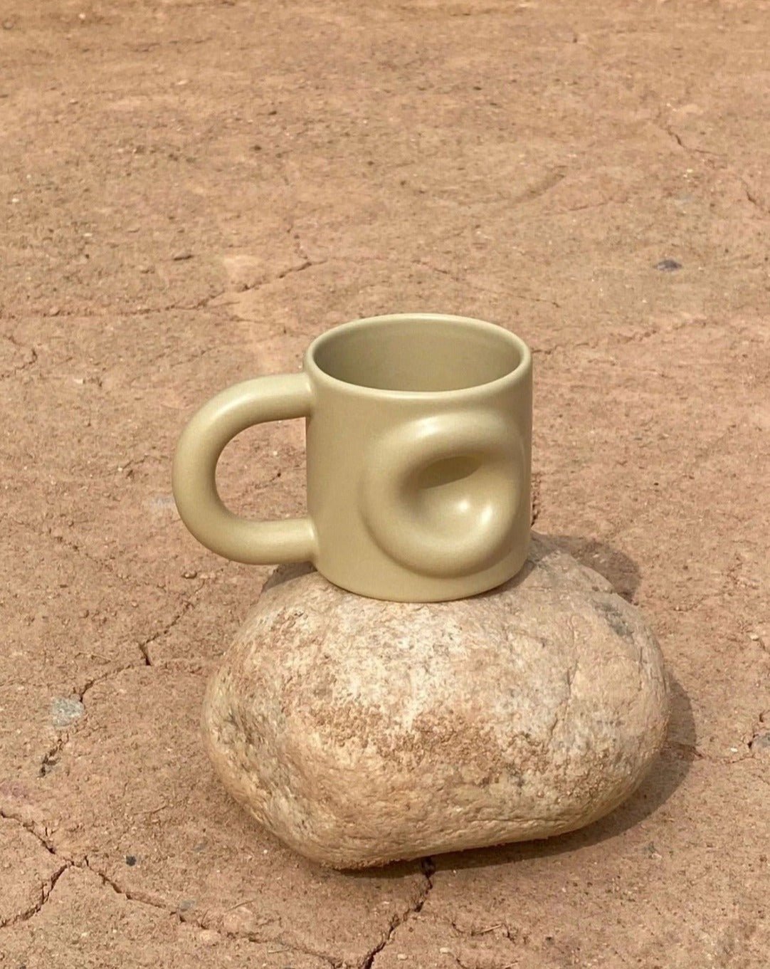 Handcrafted Ceramic Donut Mug in various colors, showcasing its unique donut shape and high-quality ceramic finish.