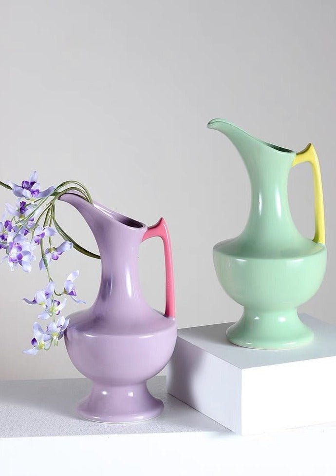 Handmade tall medieval style ceramic decorative flower vase glazed with vibrant dopamine colours, showcasing intricate details and a unique silhouette.