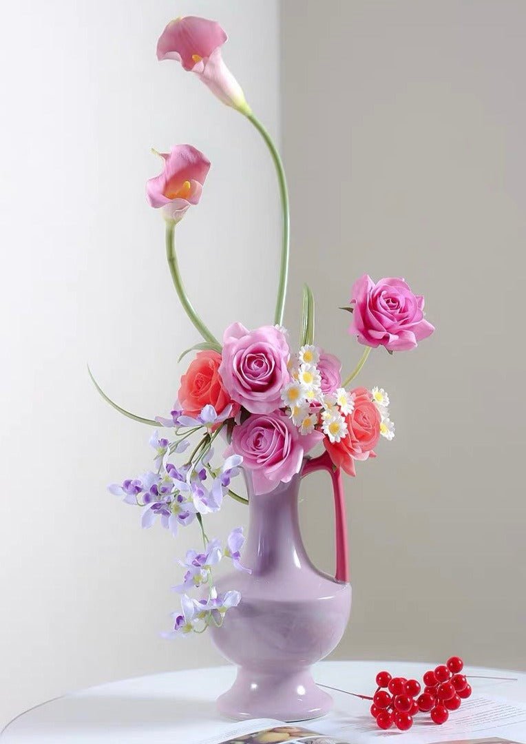 Handmade tall medieval style ceramic decorative flower vase glazed with vibrant dopamine colours, showcasing intricate details and a unique silhouette.