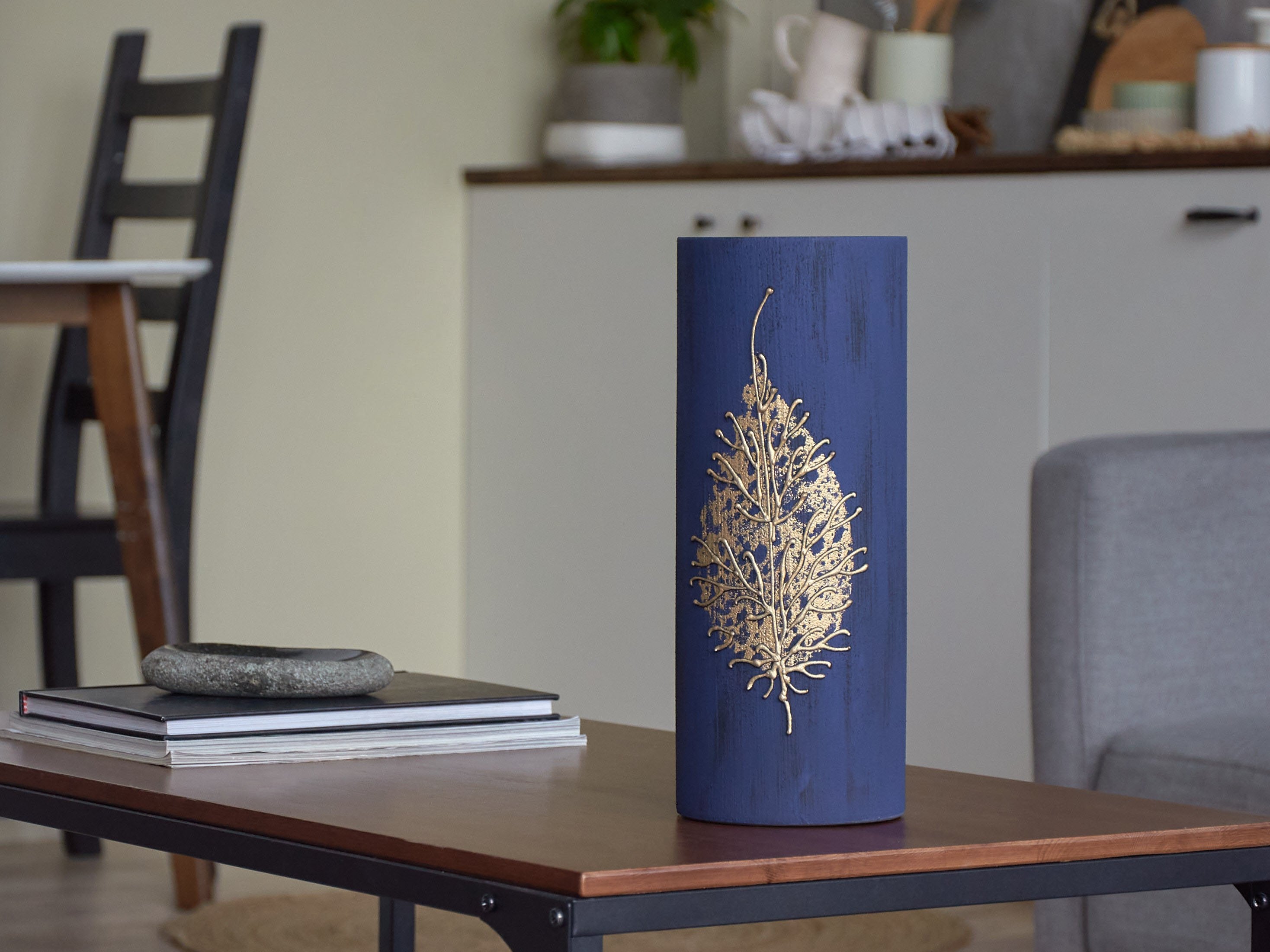 A stunning dark blue handpainted glass vase, 12 inches tall, featuring unique artistic designs perfect for displaying flowers.