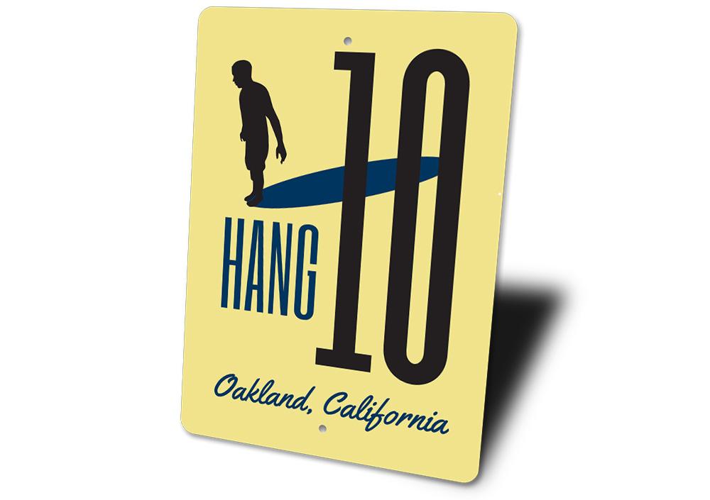 A vibrant Hang Ten Sign made of high-quality aluminum, featuring beach-themed graphics, perfect for coastal decor.