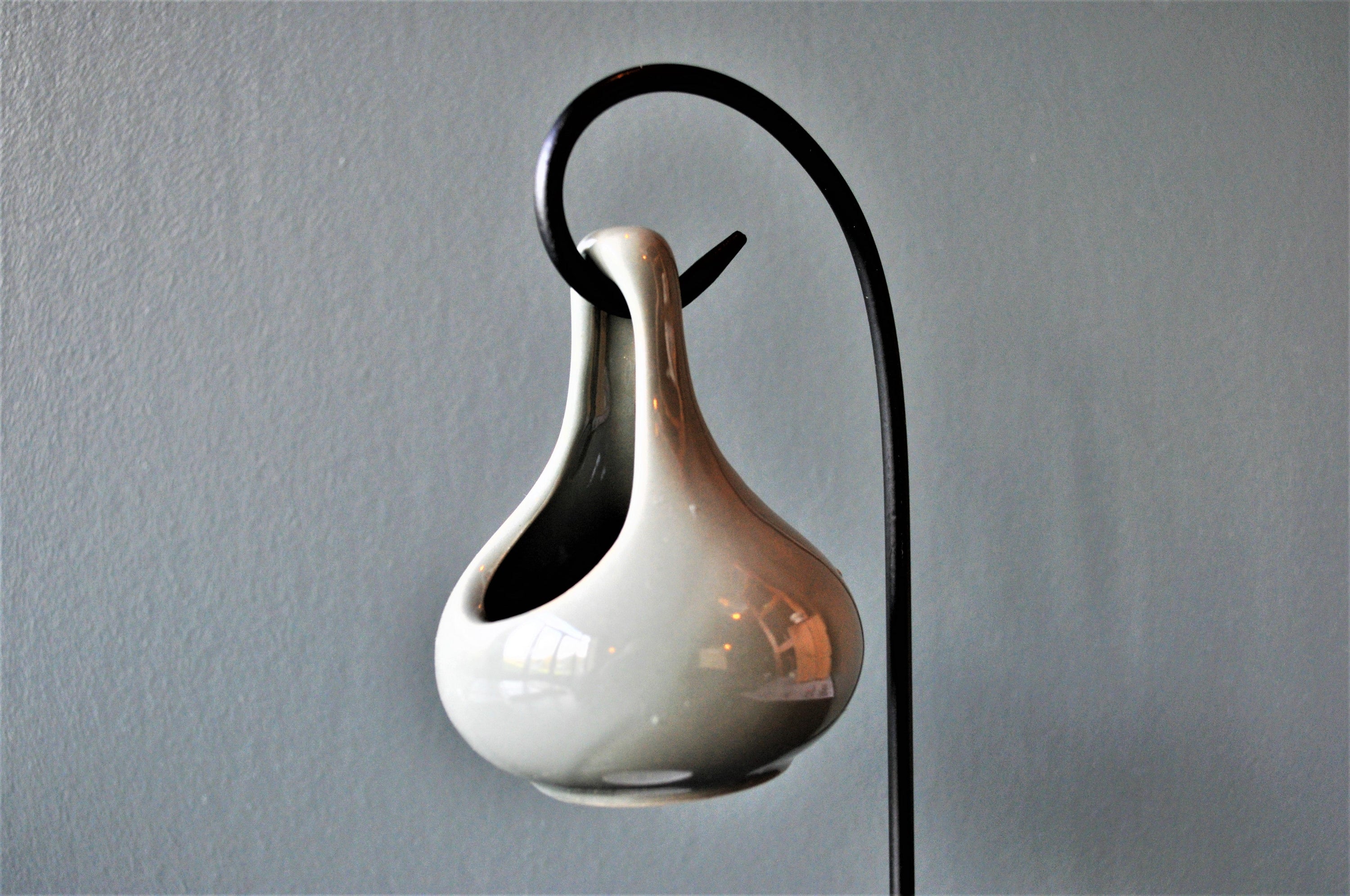 Grey hanging oil wax burner with an industrial black hanger, elegantly designed for home fragrance.