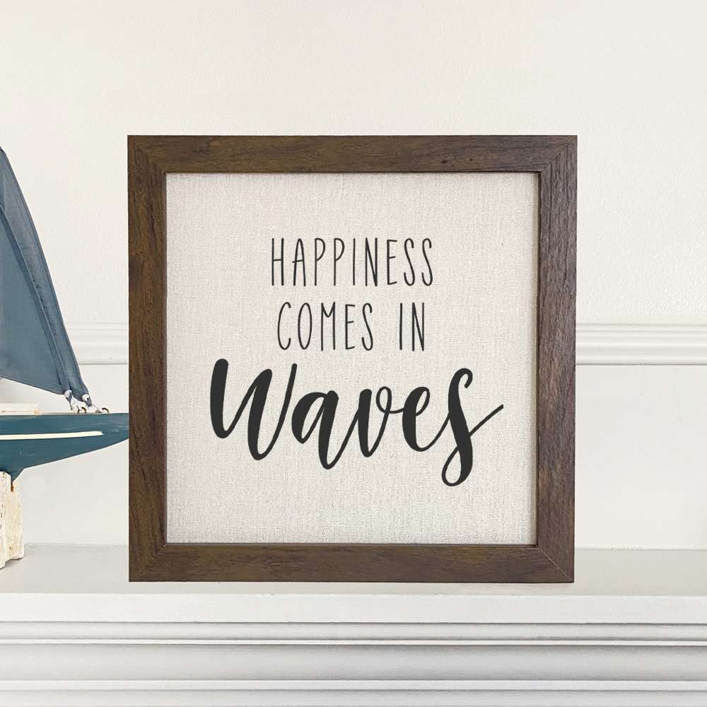 Happiness Comes in Waves framed sign with a wood frame and linen-look background, showcasing eco-friendly printing.