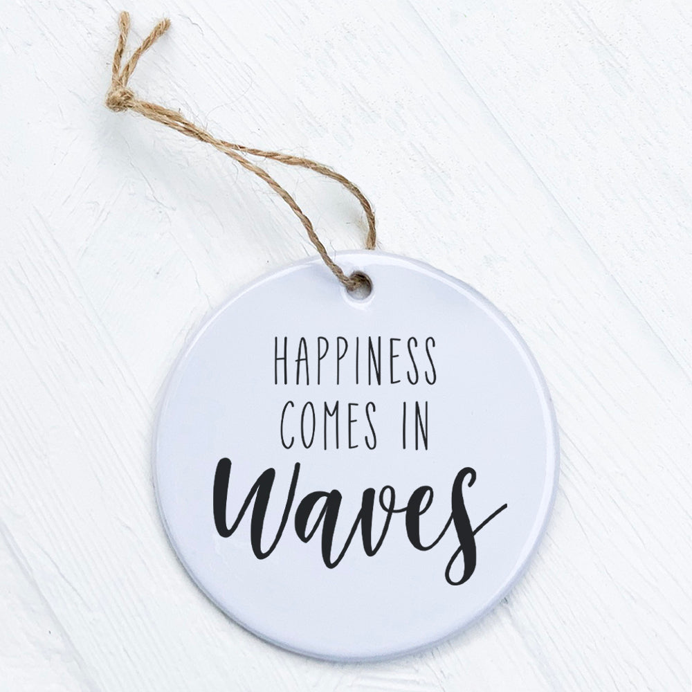 A beautiful porcelain ornament featuring the design 'Happiness Comes in Waves', showcasing vibrant colors and a smooth gloss finish.