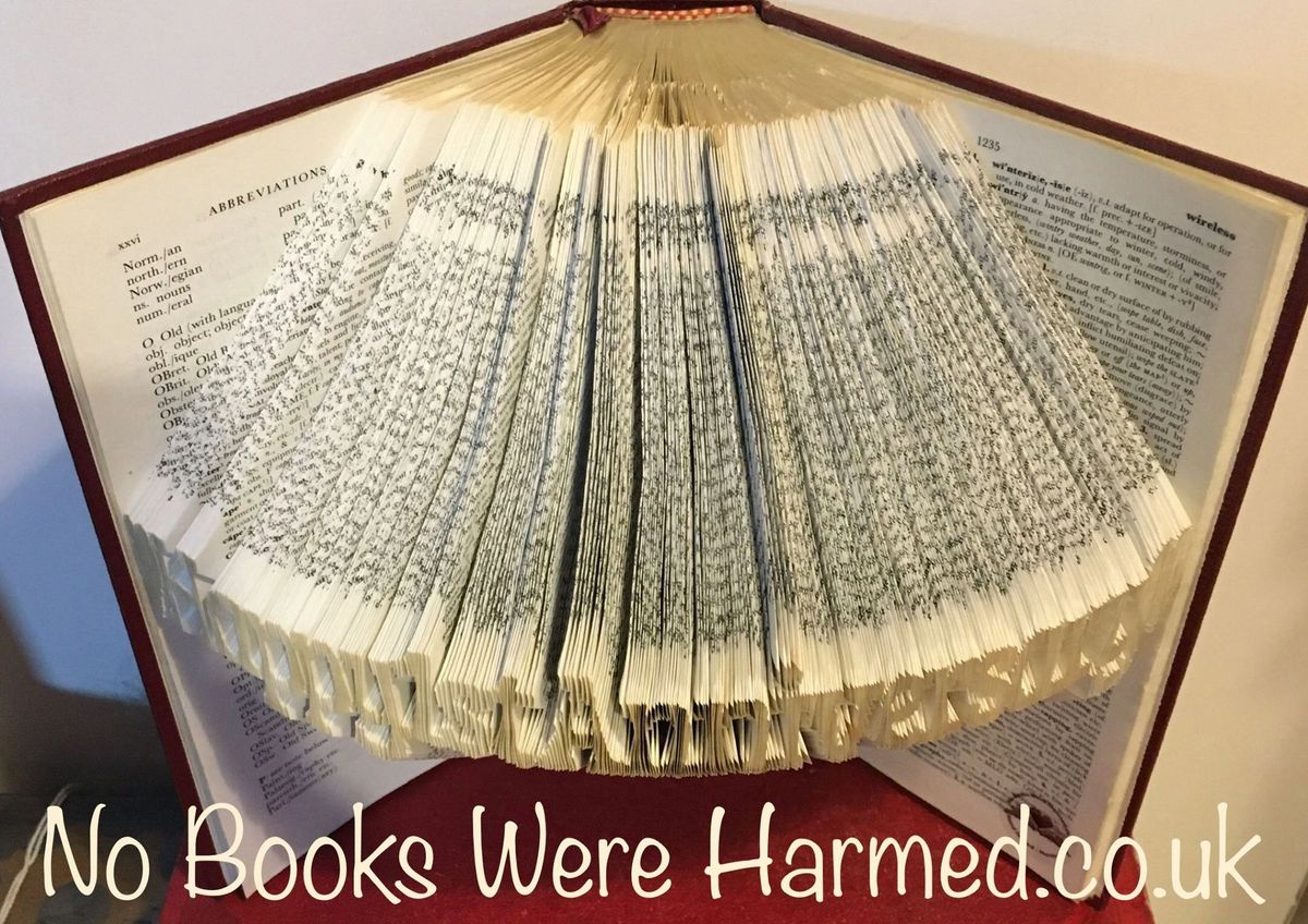 Handcrafted book art celebrating a 1st anniversary, made from vintage books with unique folds and designs.