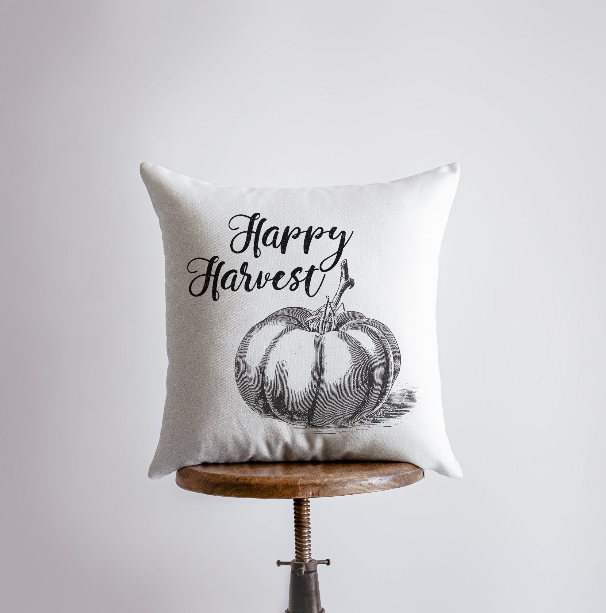 Happy Harvest pillow cover featuring a pencil-drawn pumpkin design in black cursive on a white background, perfect for modern farmhouse decor.