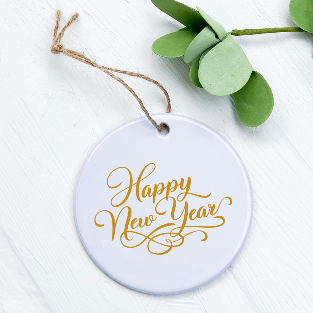 Happy New Year Gold Script ornament made of high-quality porcelain with a smooth, glossy finish, featuring elegant gold lettering.