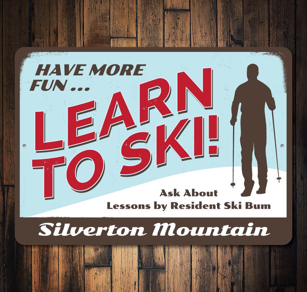 Have More Fun Skiing Sign made of aluminum, featuring a fun skiing theme, perfect for home decor.