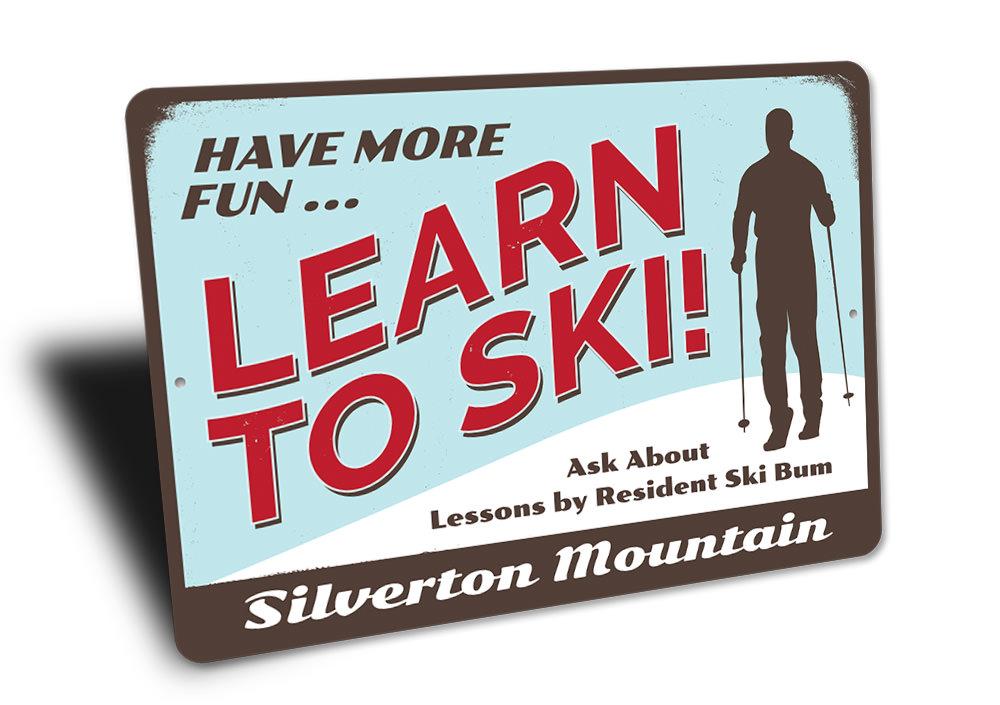 Have More Fun Skiing Sign made of aluminum, featuring a fun skiing theme, perfect for home decor.