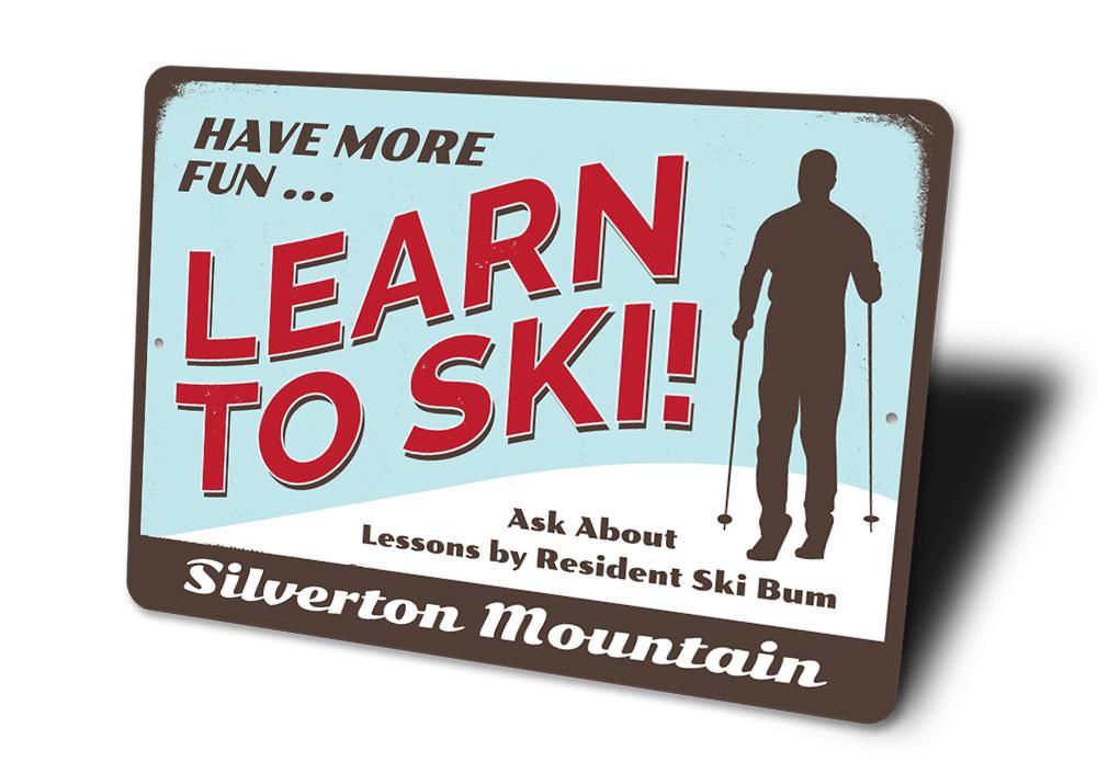 Have More Fun Skiing Sign made of aluminum, featuring a fun skiing theme, perfect for home decor.