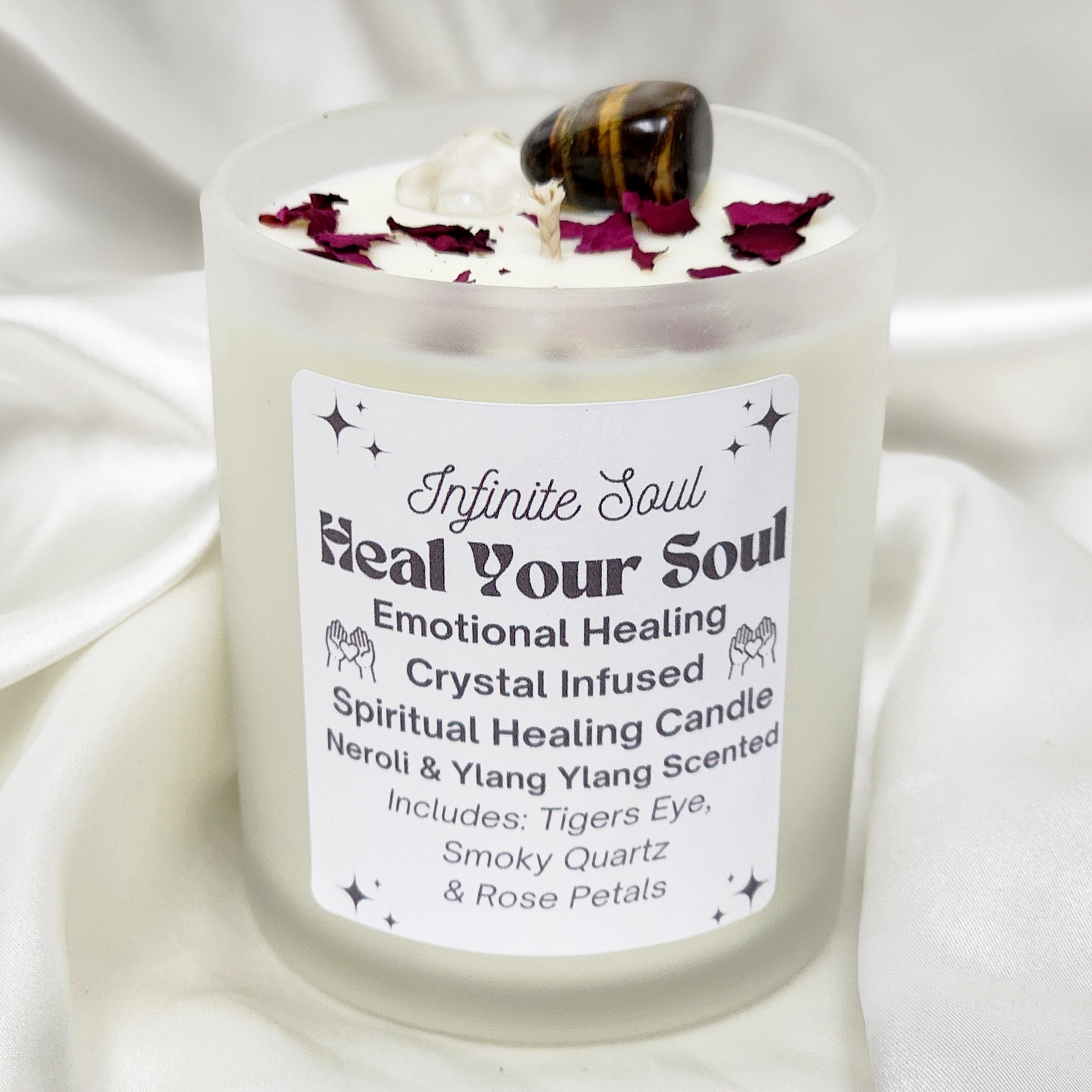 A beautifully crafted Emotional Healing Crystal Infused Candle featuring Smoky Quartz and Tigers Eye, set in a clear or frosted jar.