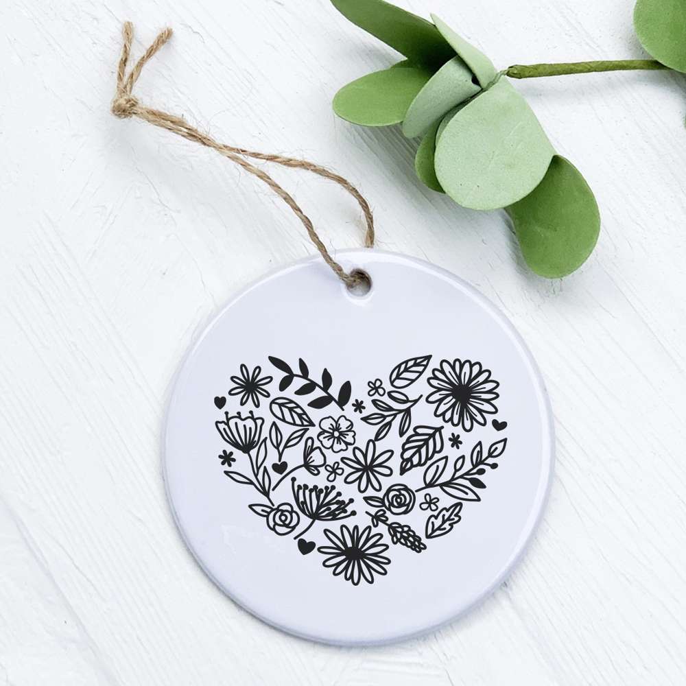 Heart of Flowers Ornament made of high-quality porcelain with a vibrant floral design, measuring 2.75 inches in diameter.