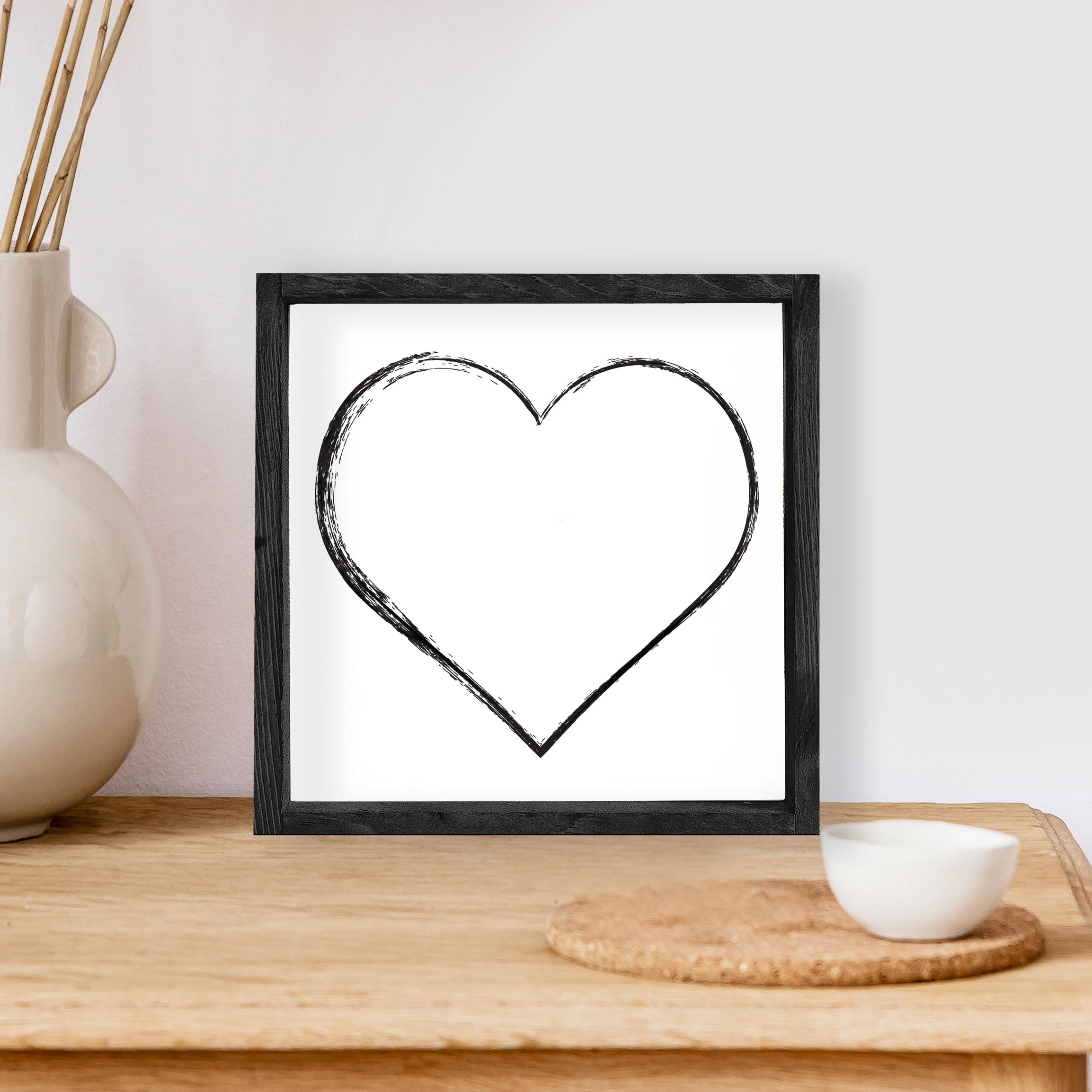 A charming Heart Wood Sign measuring 8x8 inches, featuring a stained pine wood frame and waterproof black text on a white background.