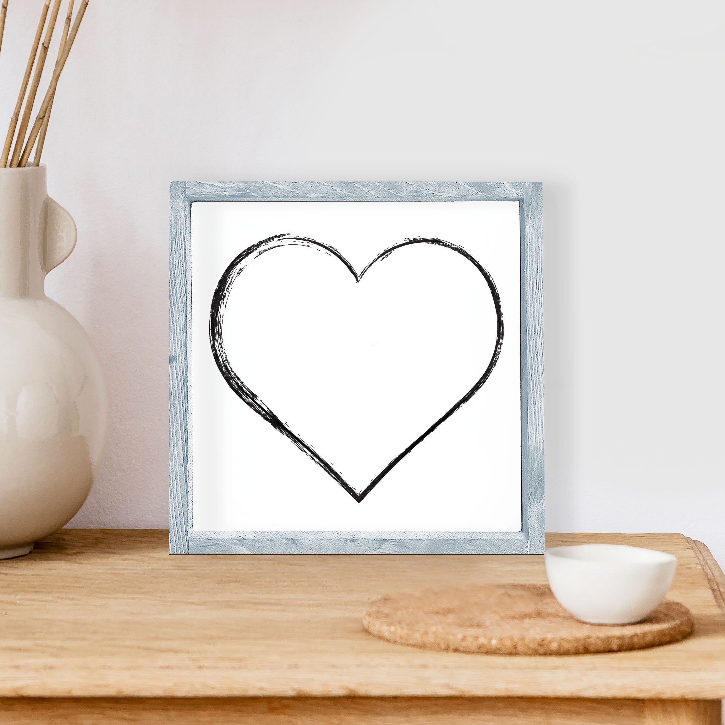 A charming Heart Wood Sign measuring 8x8 inches, featuring a stained pine wood frame and waterproof black text on a white background.