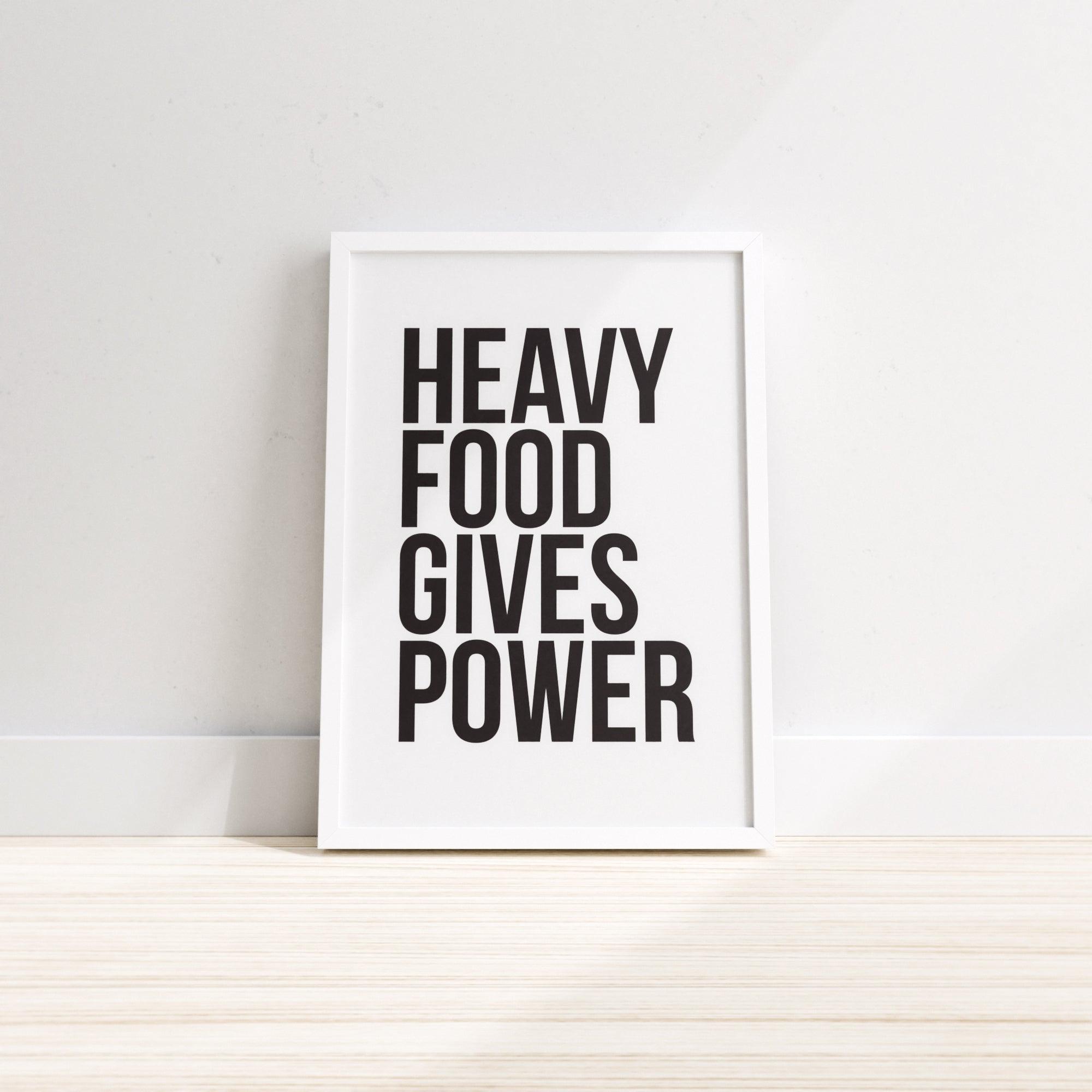 A vibrant wall print featuring the phrase 'Heavy Food Gives You Power', designed for kitchen decor, printed on premium paper.